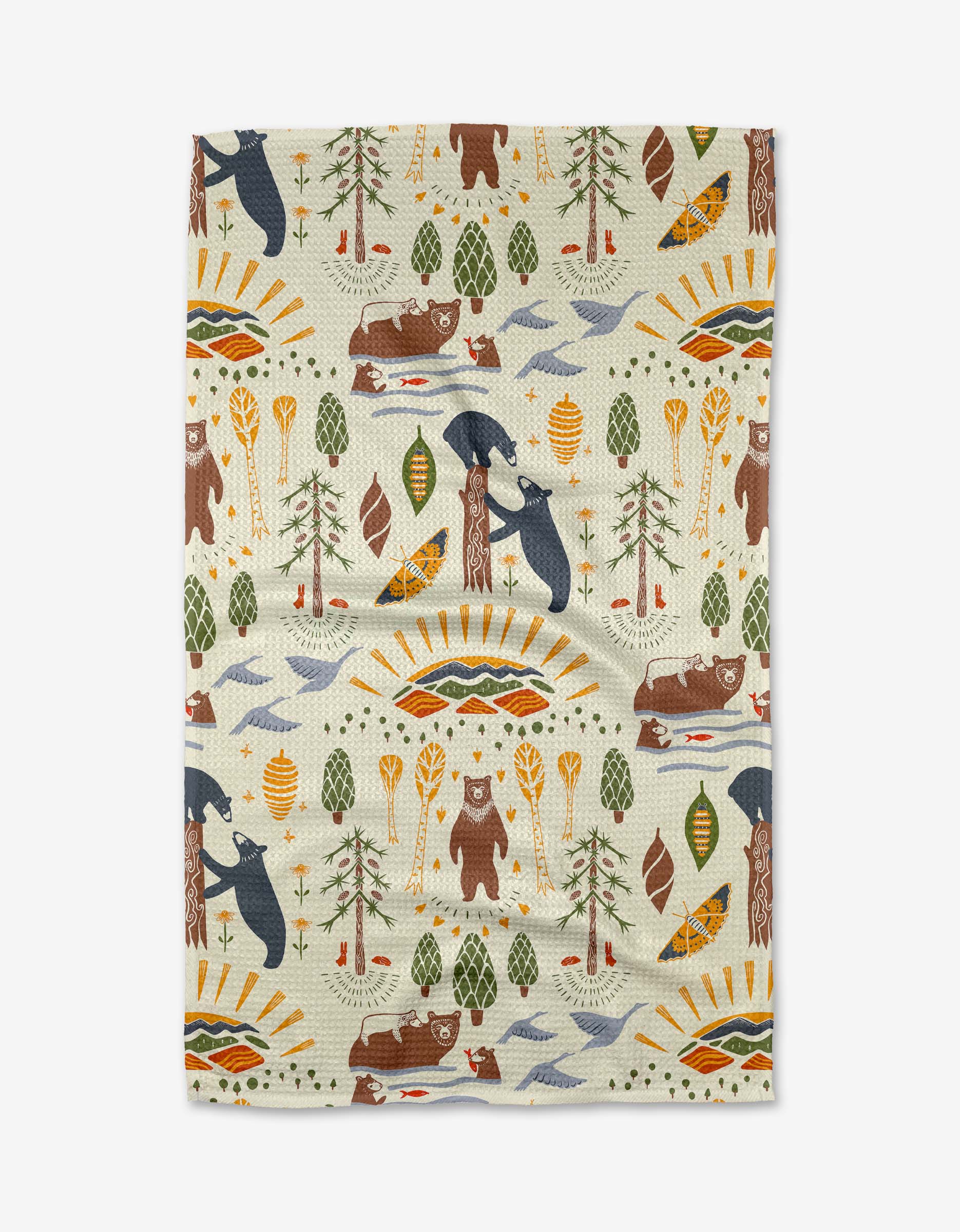 The Mama Bear towel by Elisabeth Wing features bears, trees, tents, canoes, and paddles in earthy tones on a light background. Made with ultra-absorbent Geoweave fabric, it blends geometric accents and nature motifs inspired by the outdoors.