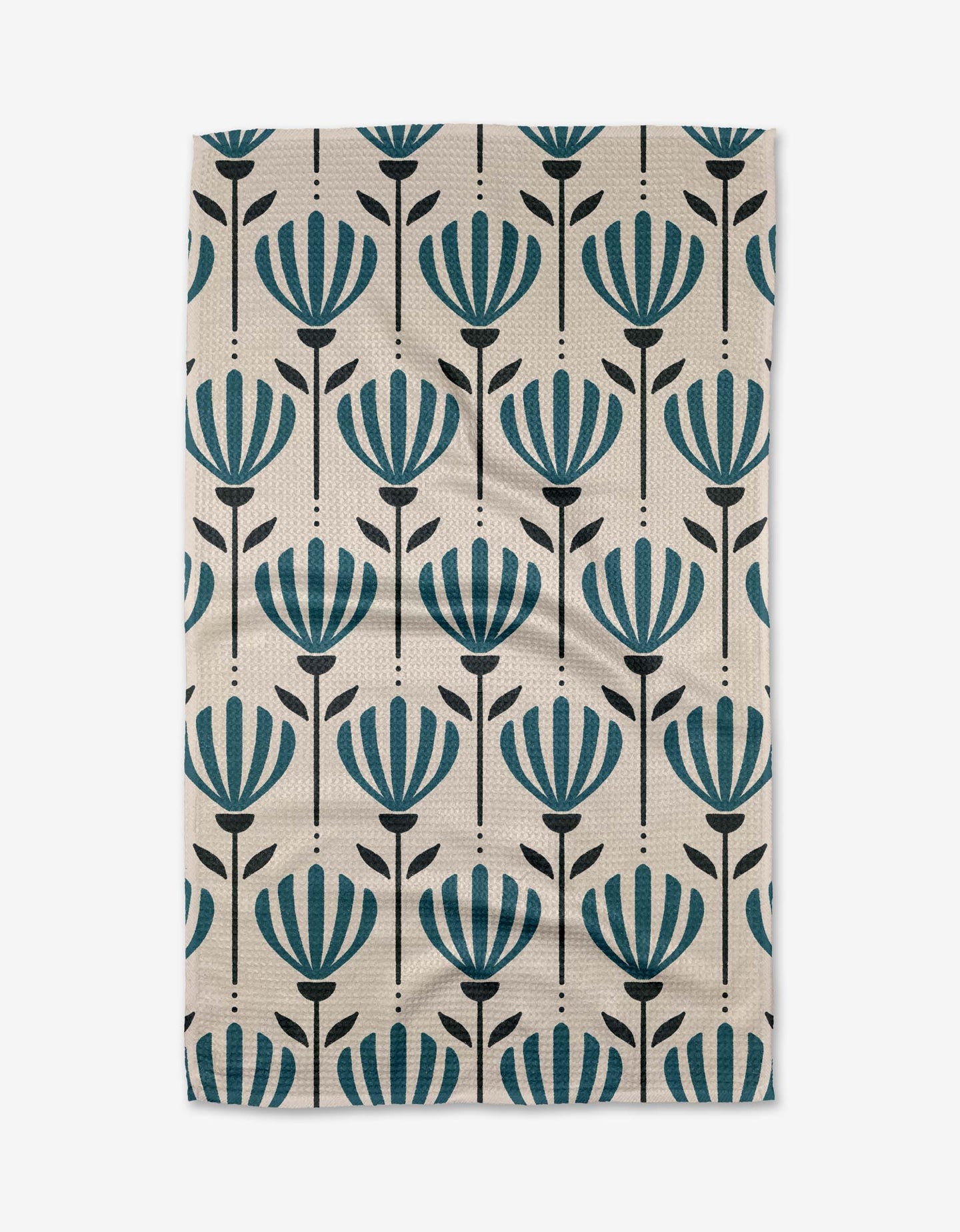 The Martine tea towel by Amy MacCready is a rectangular beige design made from recycled materials, featuring vertical rows of stylized teal flowers with black stems and leaves.