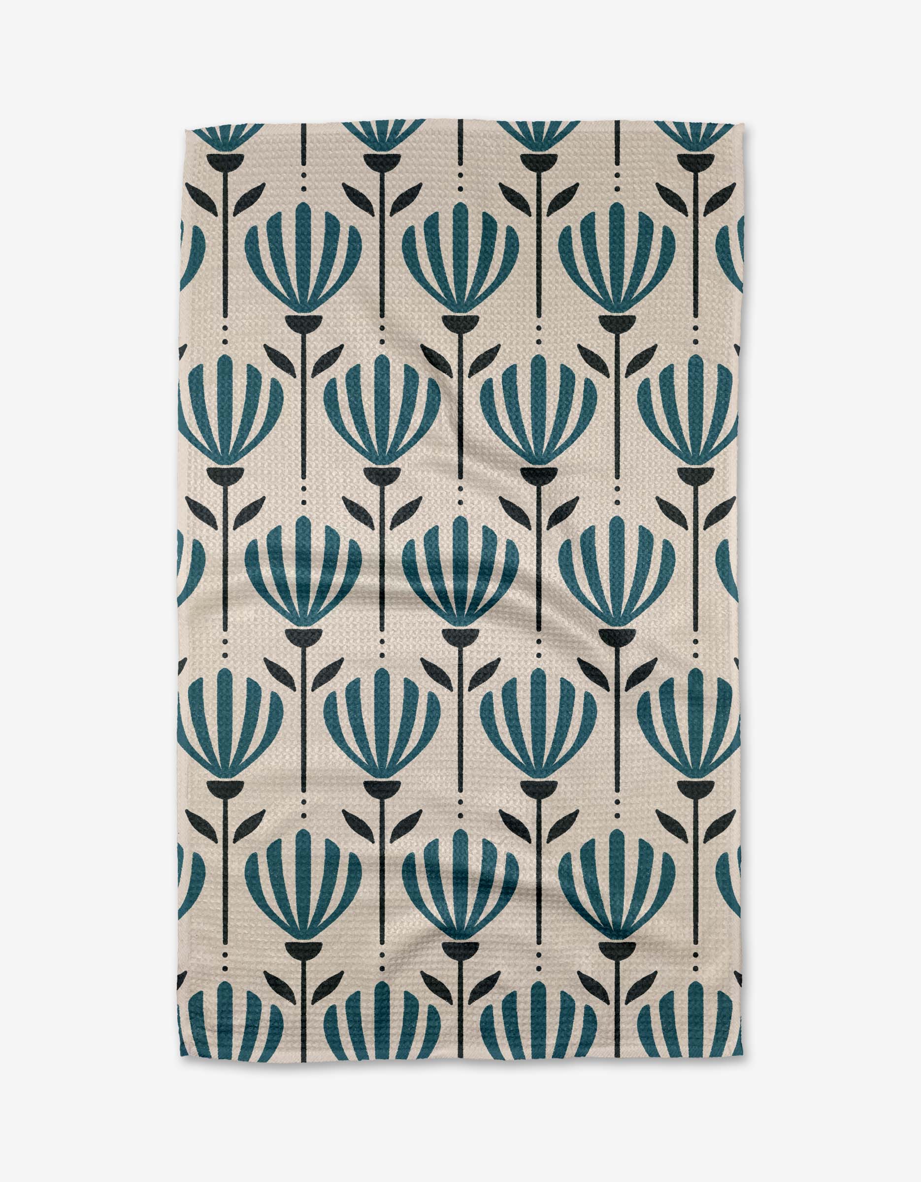The Martine tea towel by Amy MacCready is a rectangular beige design made from recycled materials, featuring vertical rows of stylized teal flowers with black stems and leaves.
