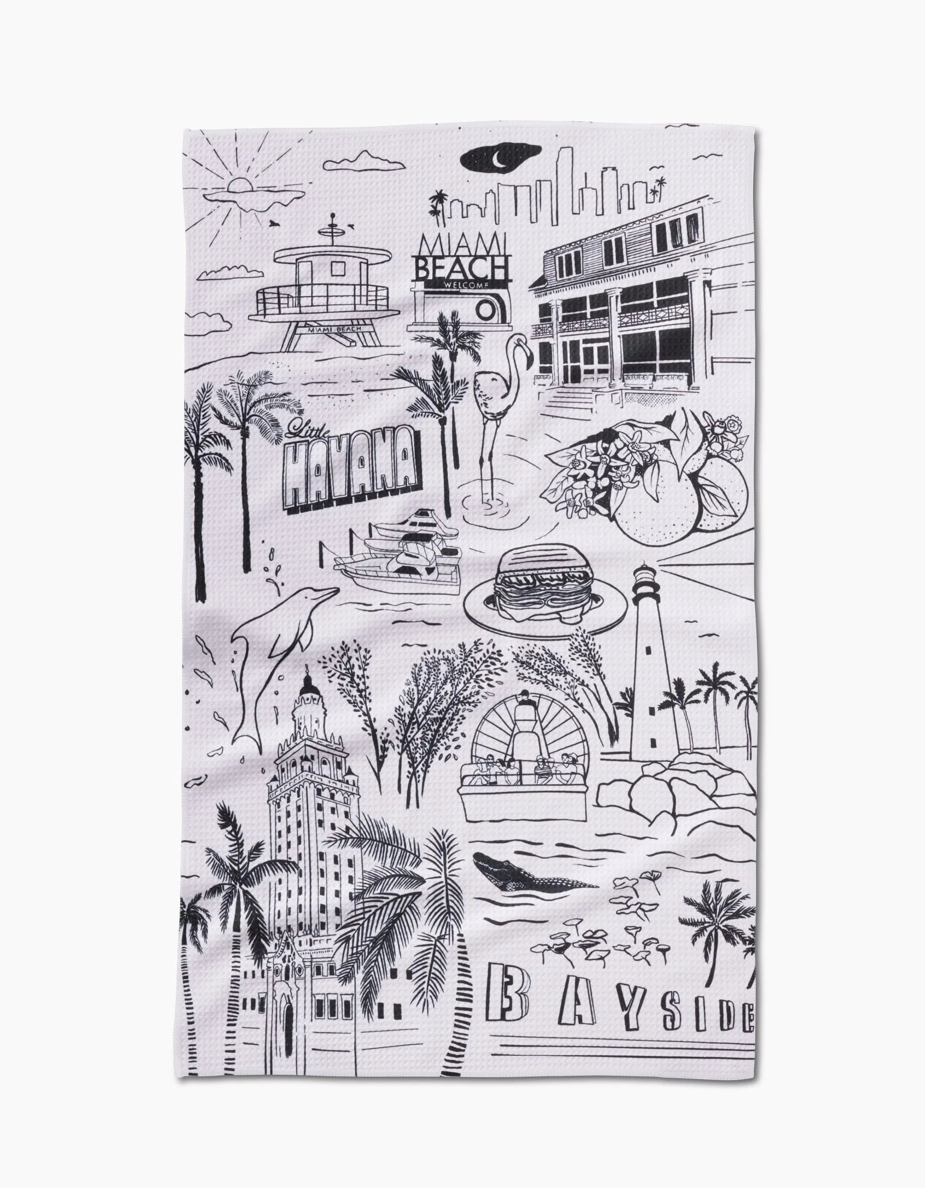 The Miami Tea Towel by Elisabeth Wing is made from Geoweave™ fabric and features black line drawings of Miami landmarks, including palm trees, Art Deco buildings, and dolphins, with “Miami Beach,” “Havana,” and “Bayside” boldly displayed.