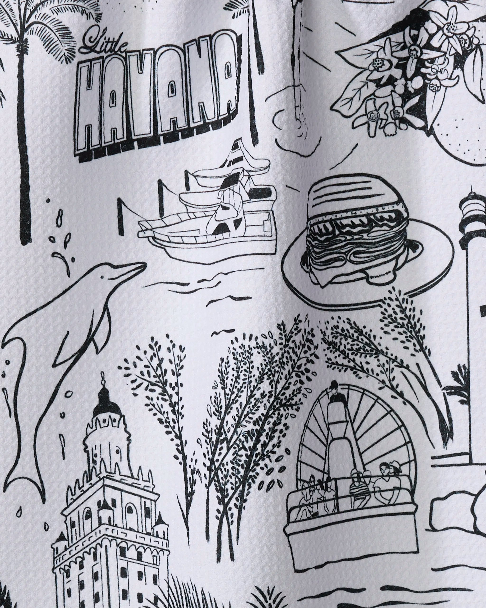 Black and white illustration titled "Miami" by Elisabeth Wing, featuring dolphins, a sandwich, a boat ride, lighthouse, trees, flowers, historic buildings—perfect for a recycled kitchen towel.
