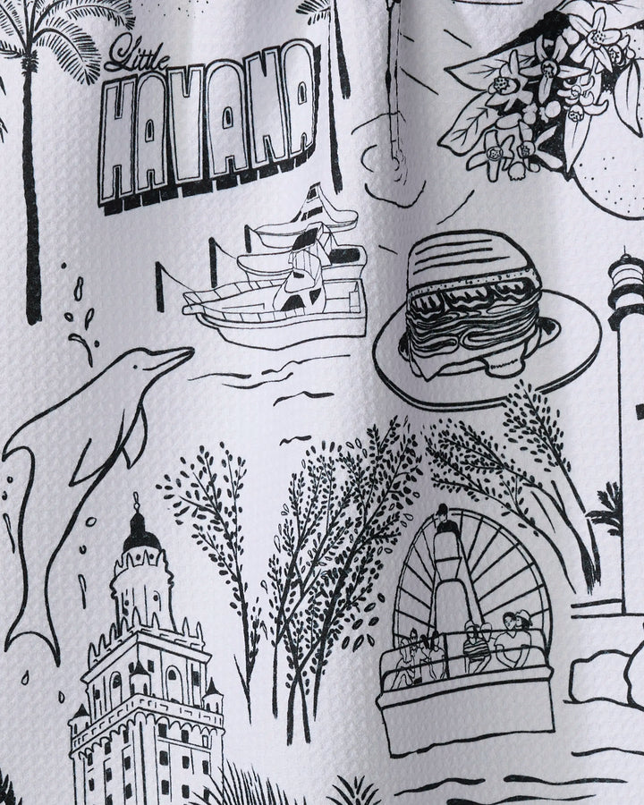 Black and white illustration titled "Miami" by Elisabeth Wing, featuring dolphins, a sandwich, a boat ride, lighthouse, trees, flowers, historic buildings—perfect for a recycled kitchen towel.