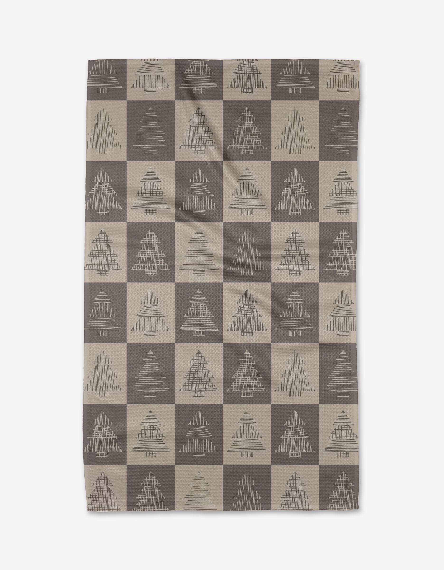 The Rosa Kichline Minimal Christmas Trees tea towel features a checkered pattern with stylized tree designs on alternating squares. Made from recycled materials, its displayed flat against a white background.