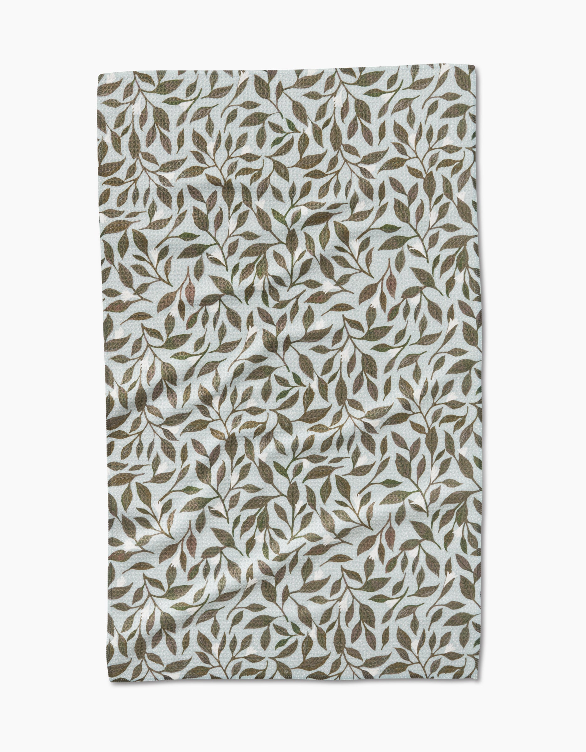 The Mint Leaves tea towel by Katie OShea features Geoweave fabric and a dense green and brown leaf pattern on white.