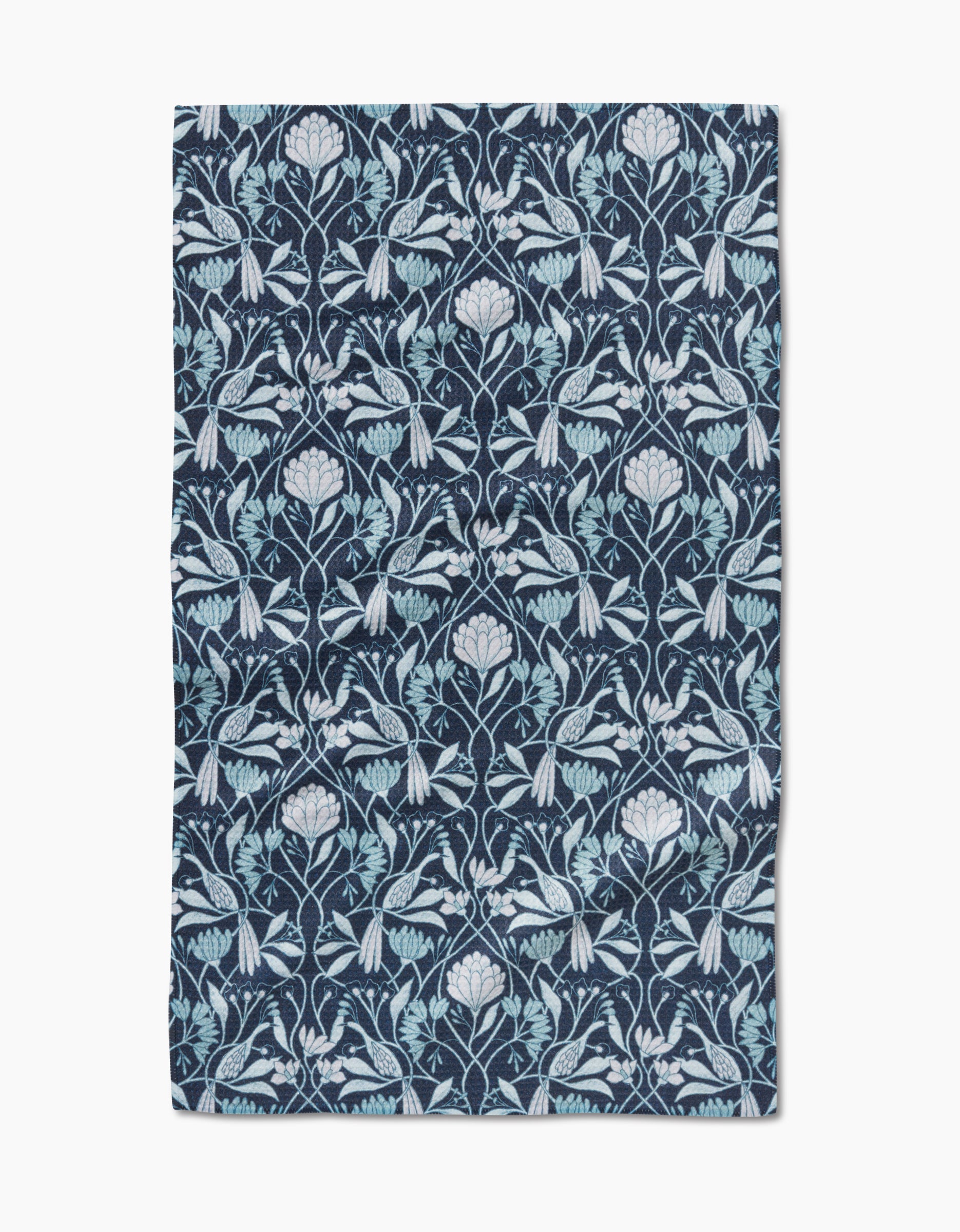 The Mirielle by Amy MacCready is a rectangular cloth made from ultra-absorbent Geoweave fabric, featuring an intricate, symmetrical floral and leaf pattern in light blue and white on a dark blue background.