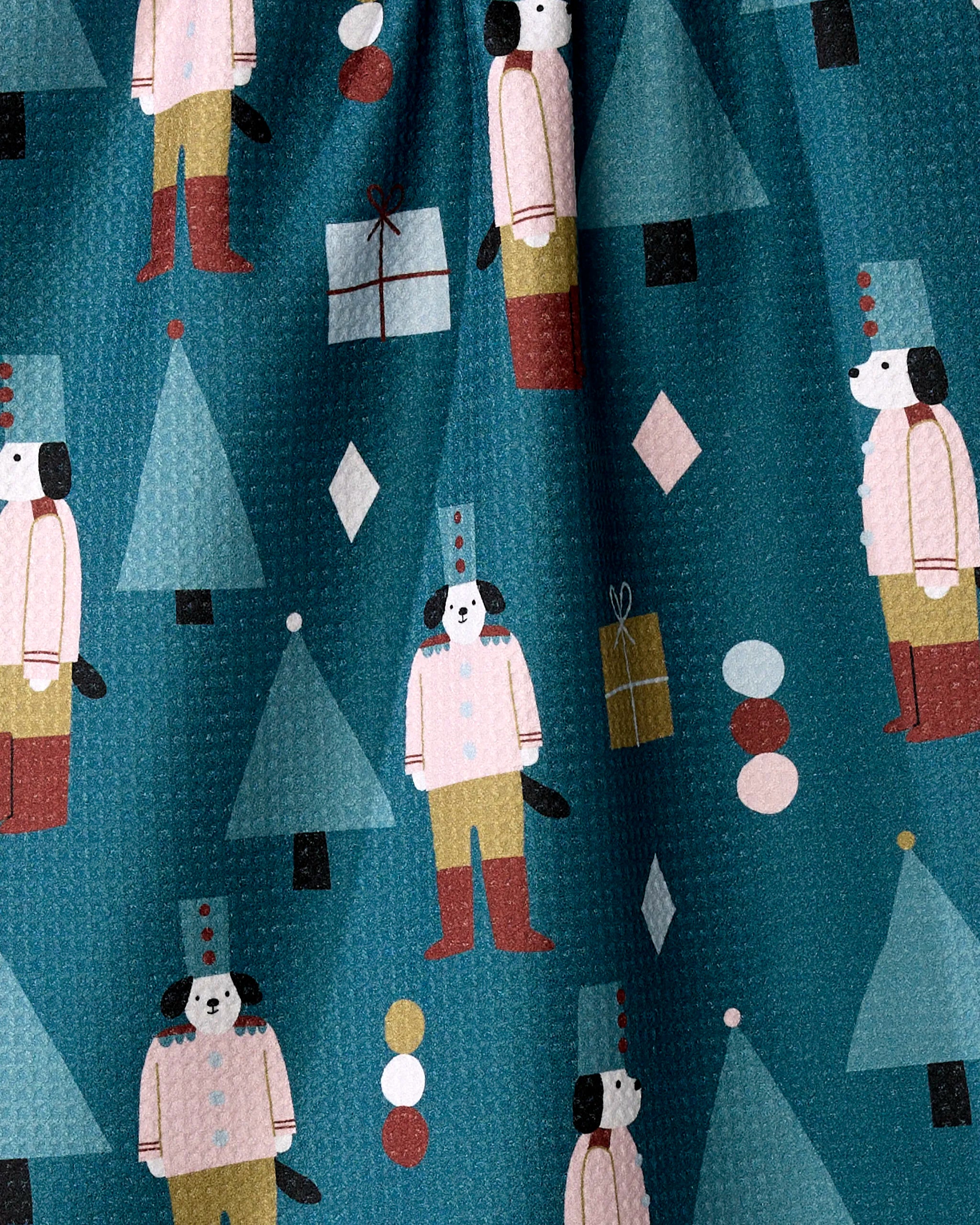 The Modern Nutcracker dish towel by Jennifer Bouron features dogs as toy soldiers, geometric trees, gift boxes, and diamonds on teal. Its absorbent, textured fabric brings stylish functionality to your kitchen.