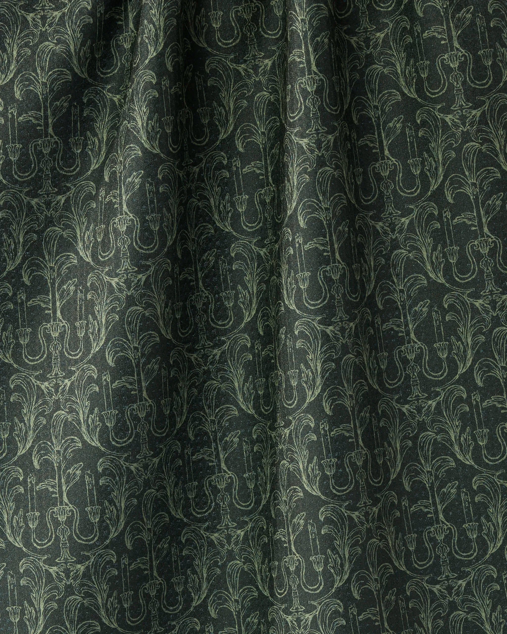 The Geometry "Moody Manor" towel features a dark green, quick-drying fabric with a subtle pattern of ornate candlesticks and leafy motifs, adding vintage-inspired elegance and texture to your kitchen or dining decor.