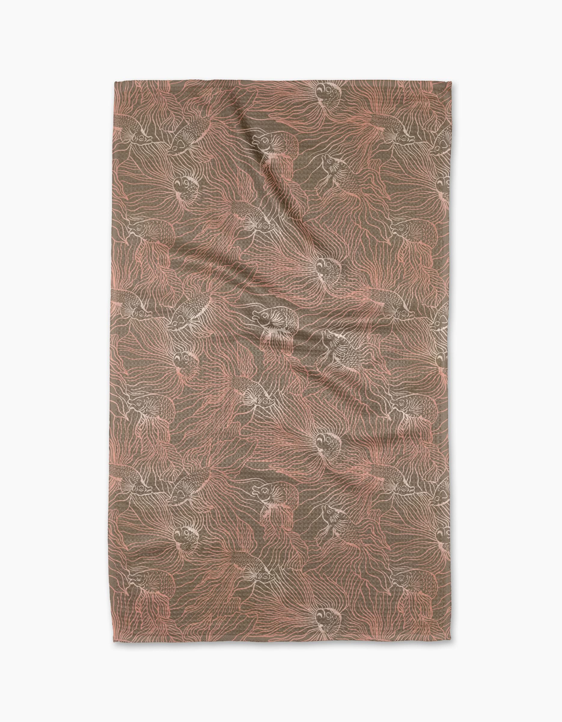 The Moonlight Beta tea towel by Elisabeth Wing is rectangular, made from recycled materials, and features abstract, flowing brown and pink lines and shapes. It’s shown laid flat with gentle wrinkles on a white background.