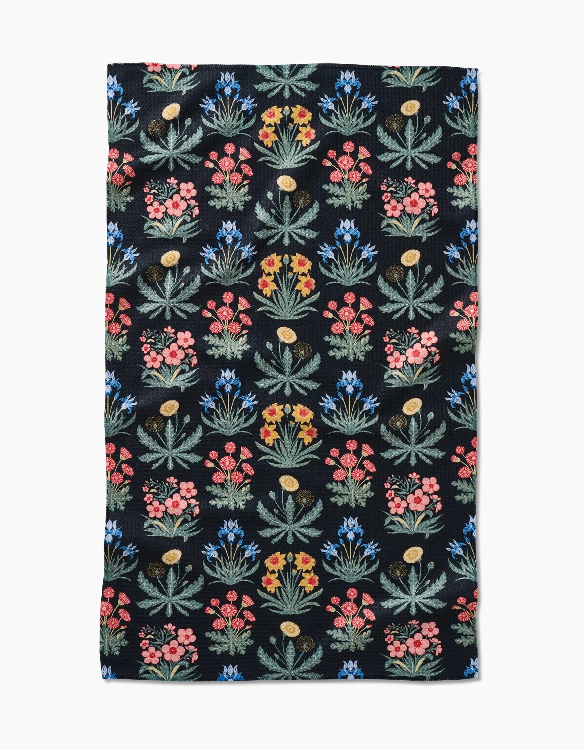 The Morning Meadow Tea Towel by Danelys Sidron features a black rectangular design with rows of vibrant, stylized red, yellow, blue, and green flowers on durable Geoweave™ fabric.