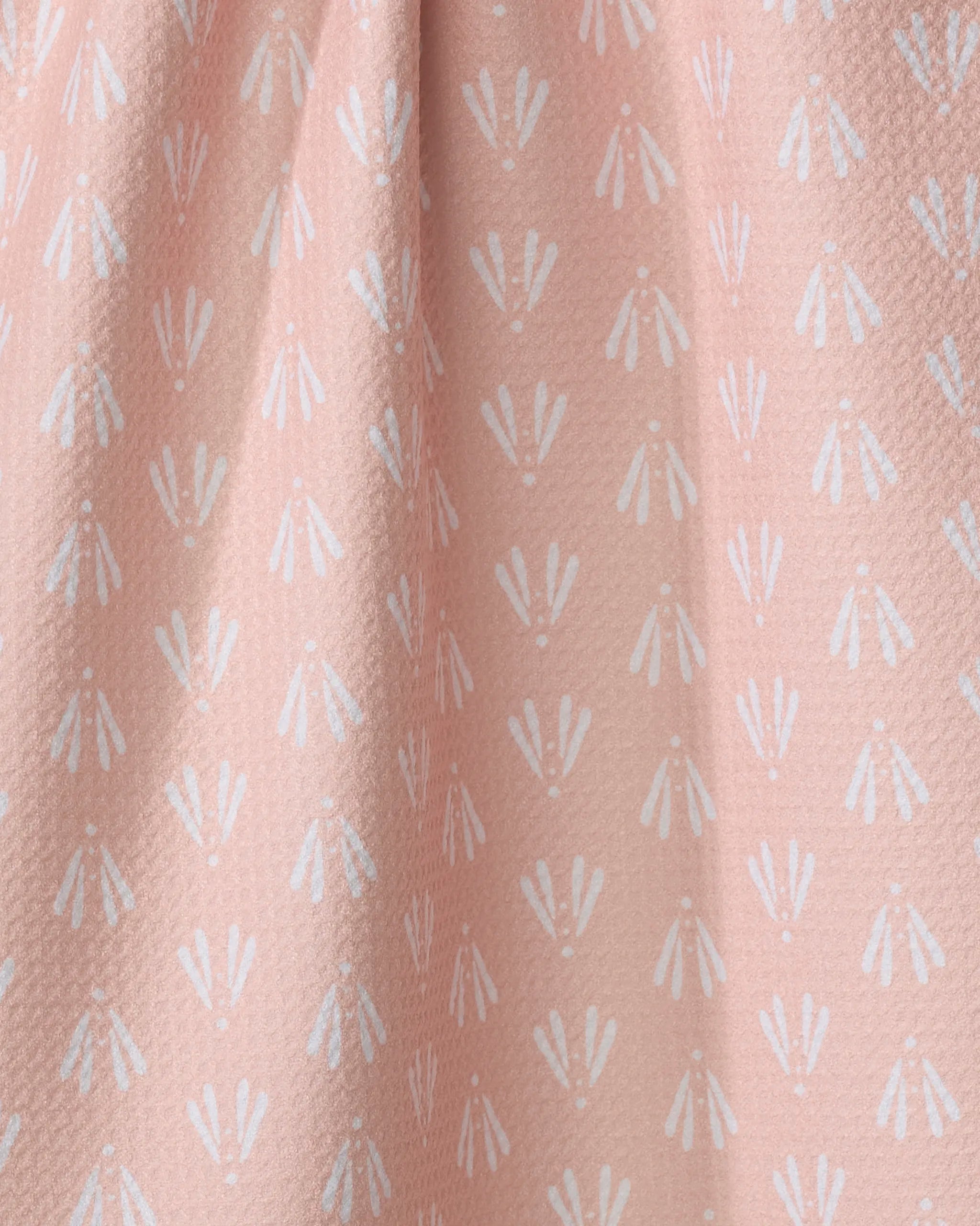 Moth Geometric by Hufton Studio features light pink Geoweave fabric with textured surface and a repeating white geometric floral pattern, ideal for elegant tea towels crafted from recycled materials.