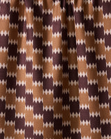 The Geometry Mountain Song recycled kitchen towel features a visually dynamic geometric pattern with alternating brown, tan, and beige diamond shapes in vertical rows.