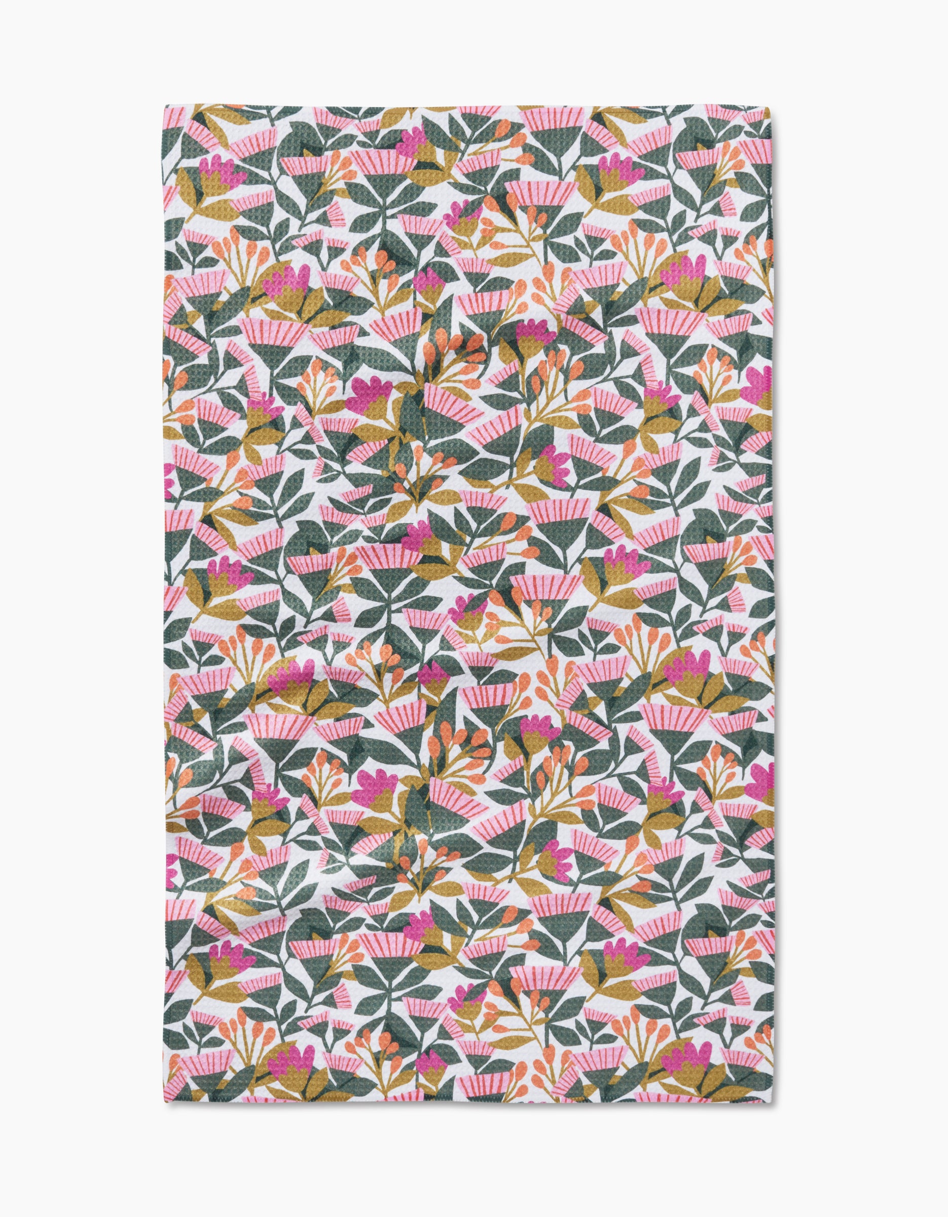 The Lisa Nelson Moxie Mauve tea towel features pink, orange, and gold flowers with green leaves on white Geoweave fabric.