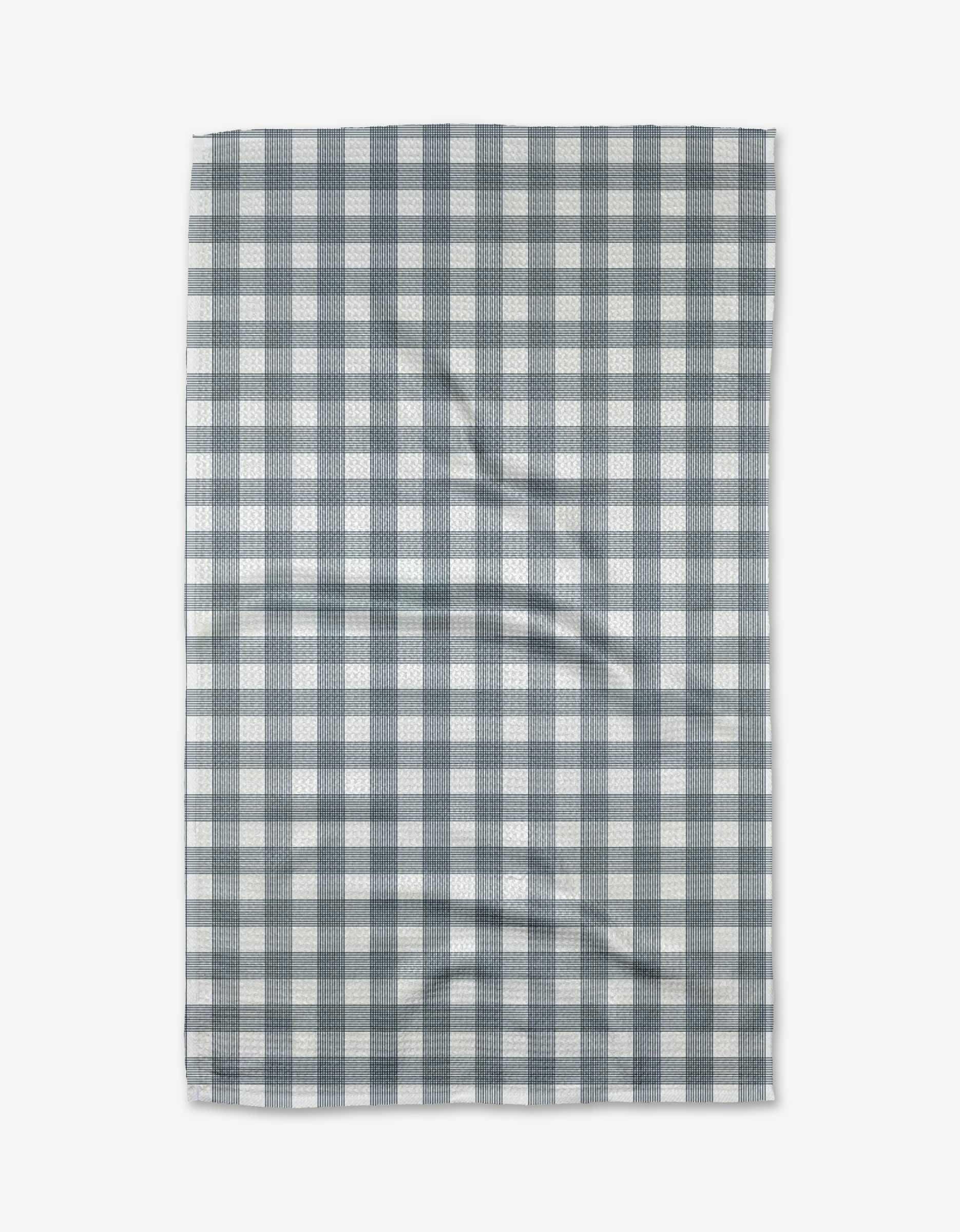 The Buy Guide’s Multi Gingham - Navy tea towel features a black and white checkered pattern in Geoweave™ fabric, shown flat with slight wrinkles on a white background.