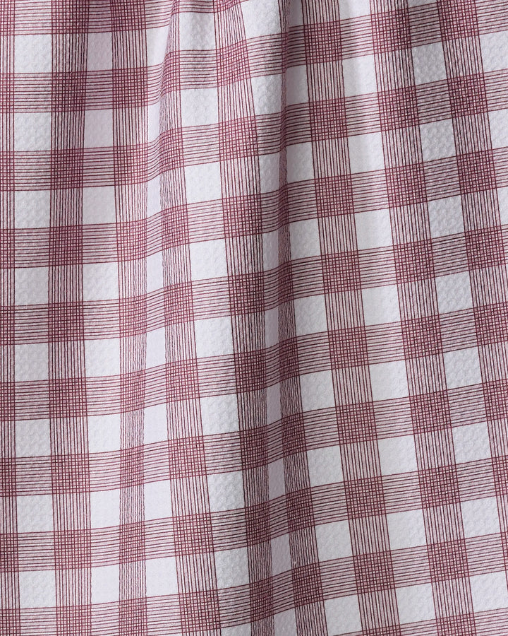 Close-up of The Buy Guide’s Multi Gingham - Wine kitchen towel, featuring ultra-absorbent fabric and a red and white checkered pattern with evenly spaced squares and slight texture.