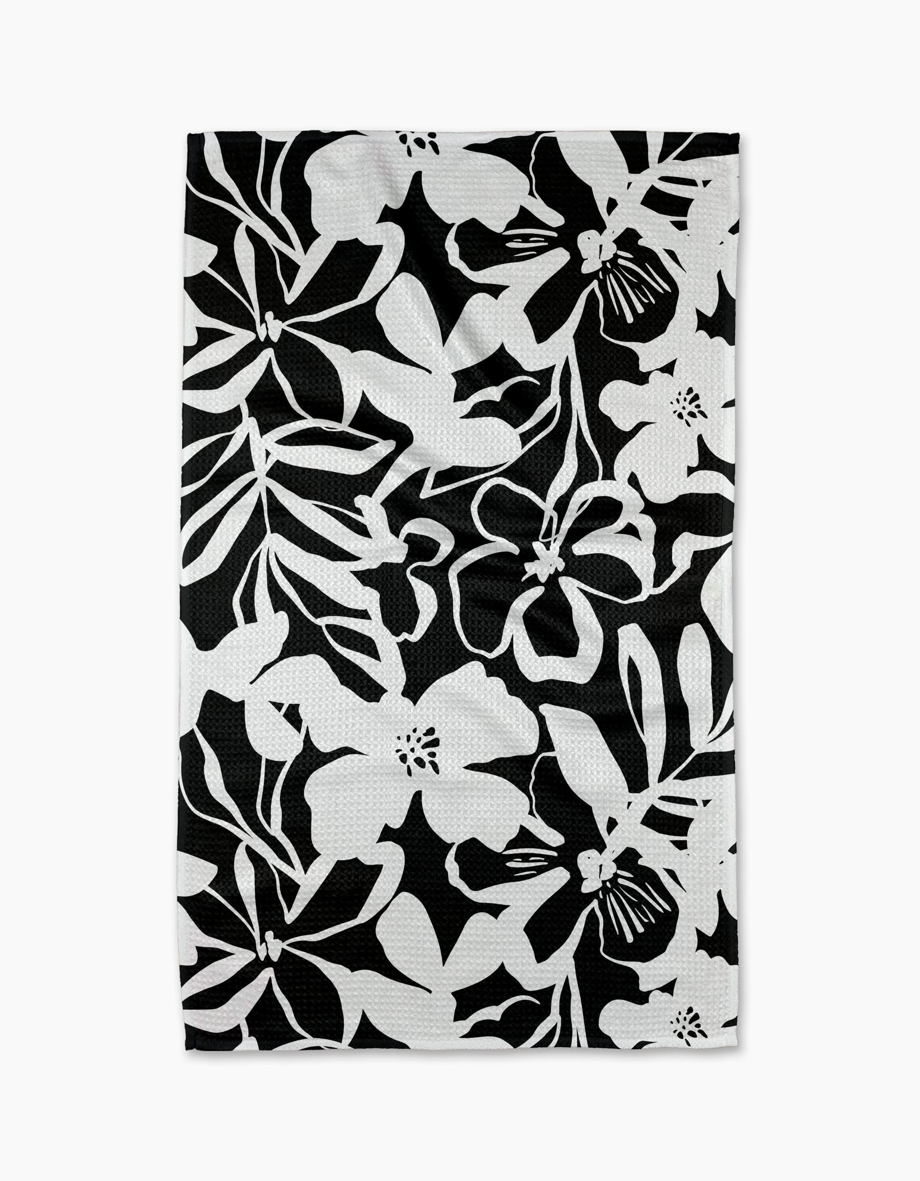 The Night Meadow dish towel by Marina Solodka features a bold black and white floral pattern—ideal as an eco-friendly kitchen or tea towel.