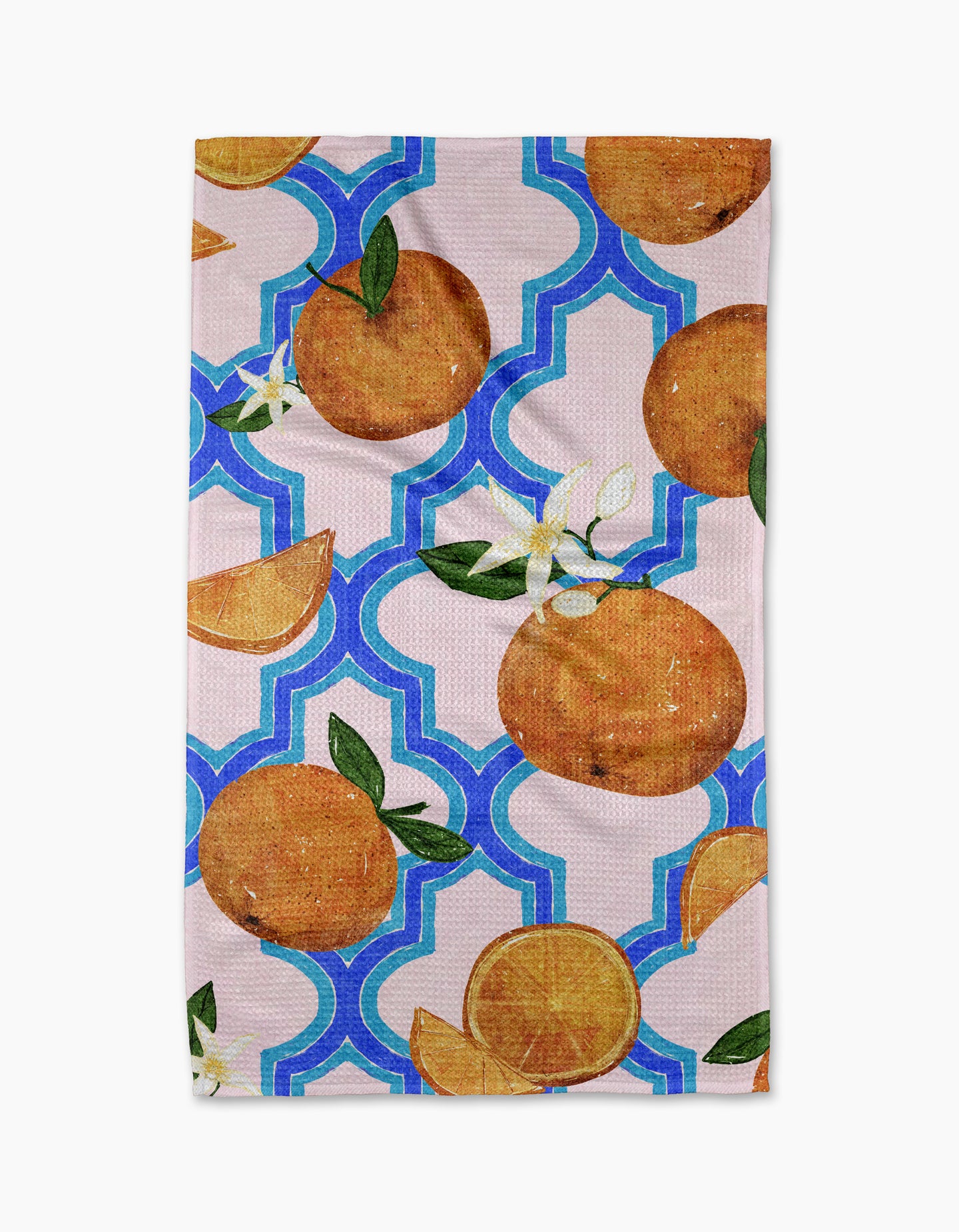 The Orange Trellis recycled kitchen towel by Pascale Dilger showcases oranges, blossoms, slices, and green leaves set against a blue and white geometric background.