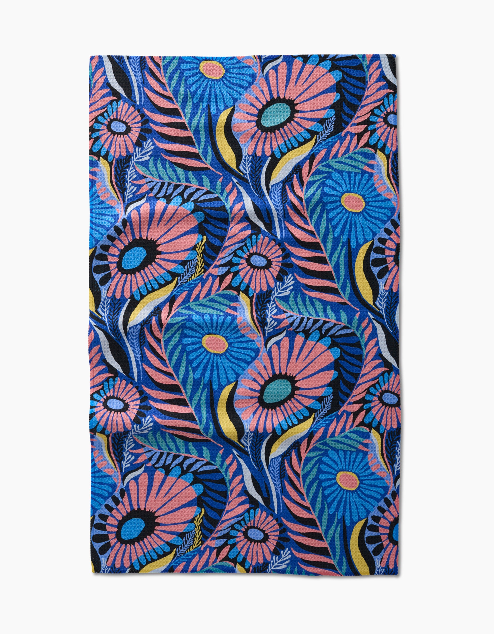 The Palm Beach tea towel by Masha Volnova features a vibrant floral pattern with large blue, pink, and yellow flowers and green leaves on a blue background, crafted from recycled materials.