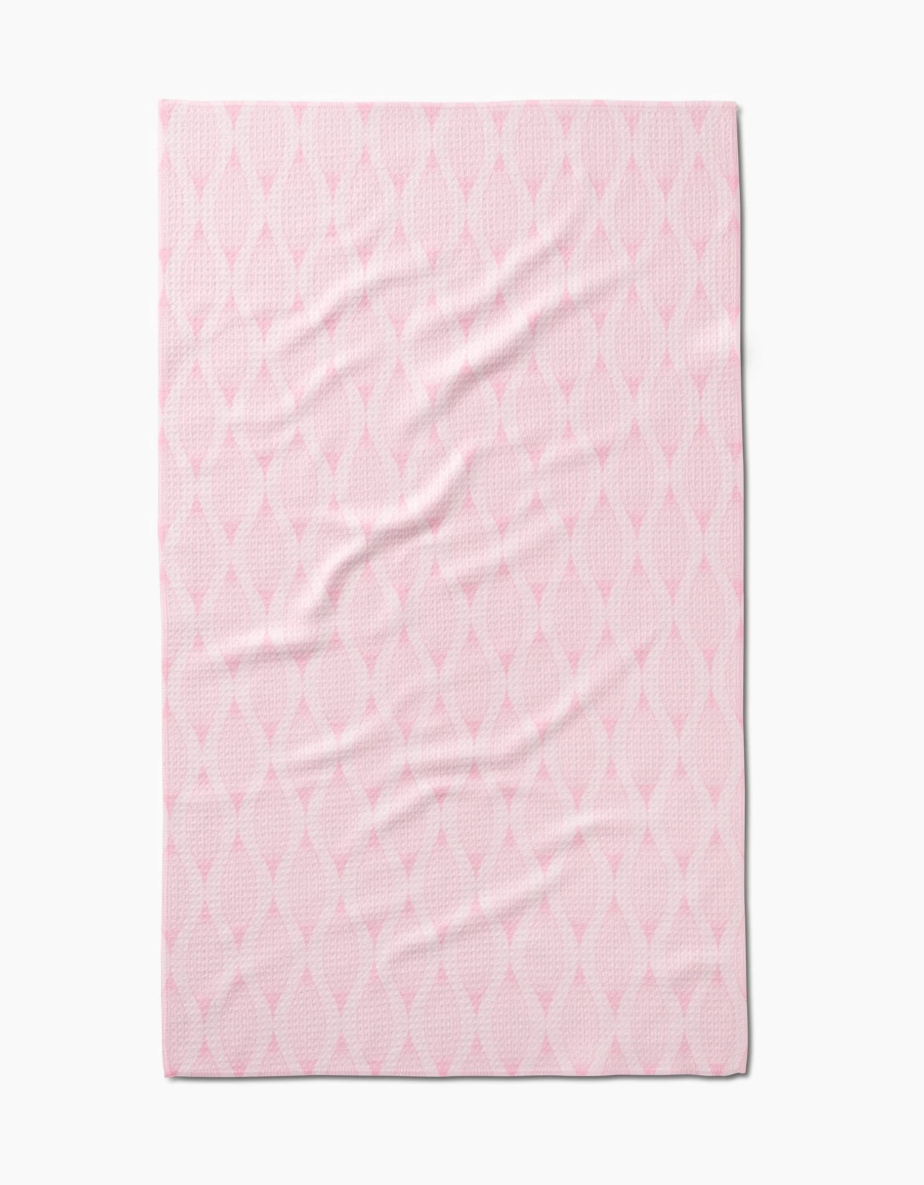 The Shelley Smith Patterned in Pink blanket features Geoweave fabric and a subtle diamond-shaped lattice in light and deeper pink, shown laid flat with gentle wrinkles.