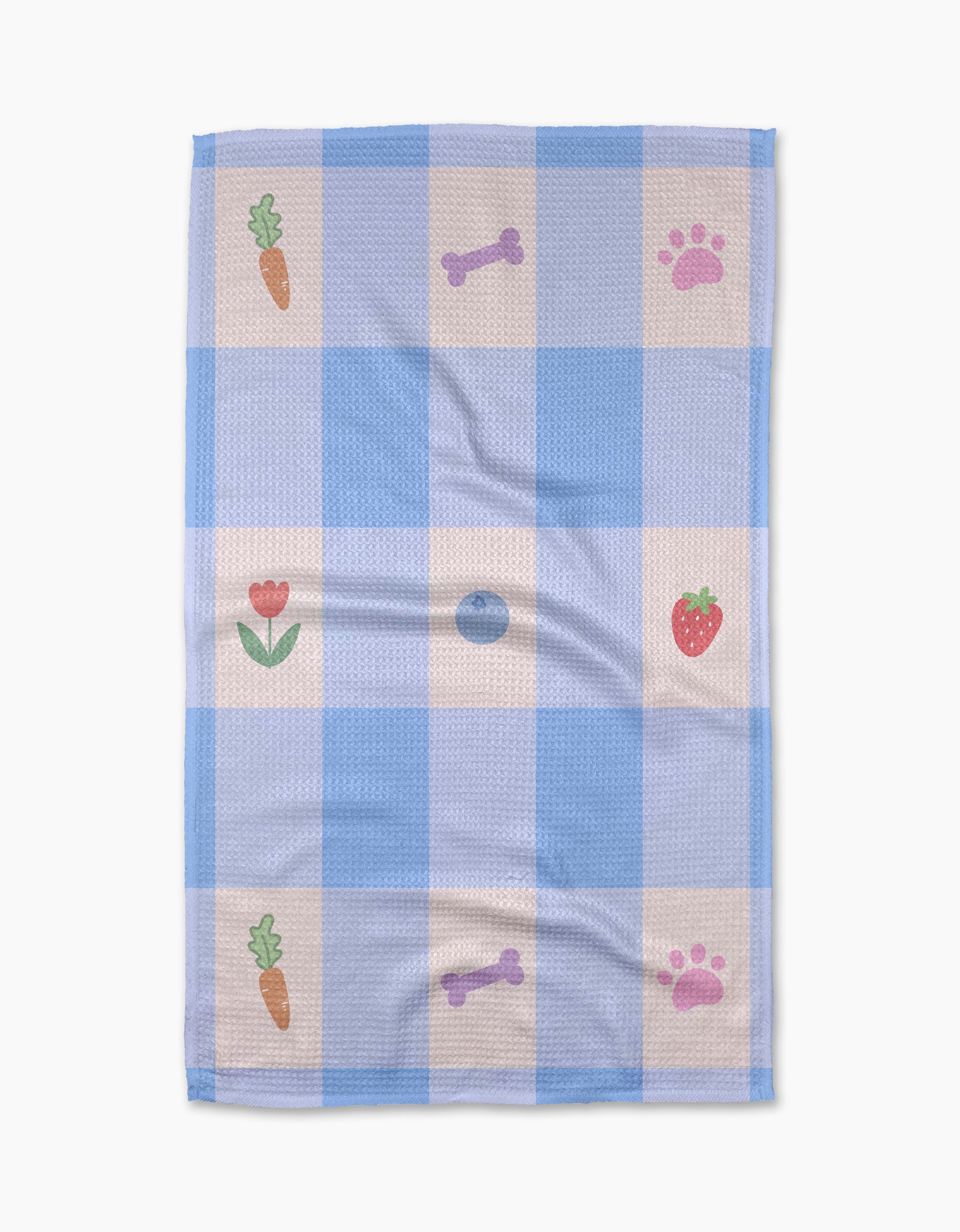 The Pawfect Picnic towel by Letters By Shells is a blue and white checkered, ultra-absorbent towel with carrot, strawberry, bone, paw print, and tulip patterns in some squares.