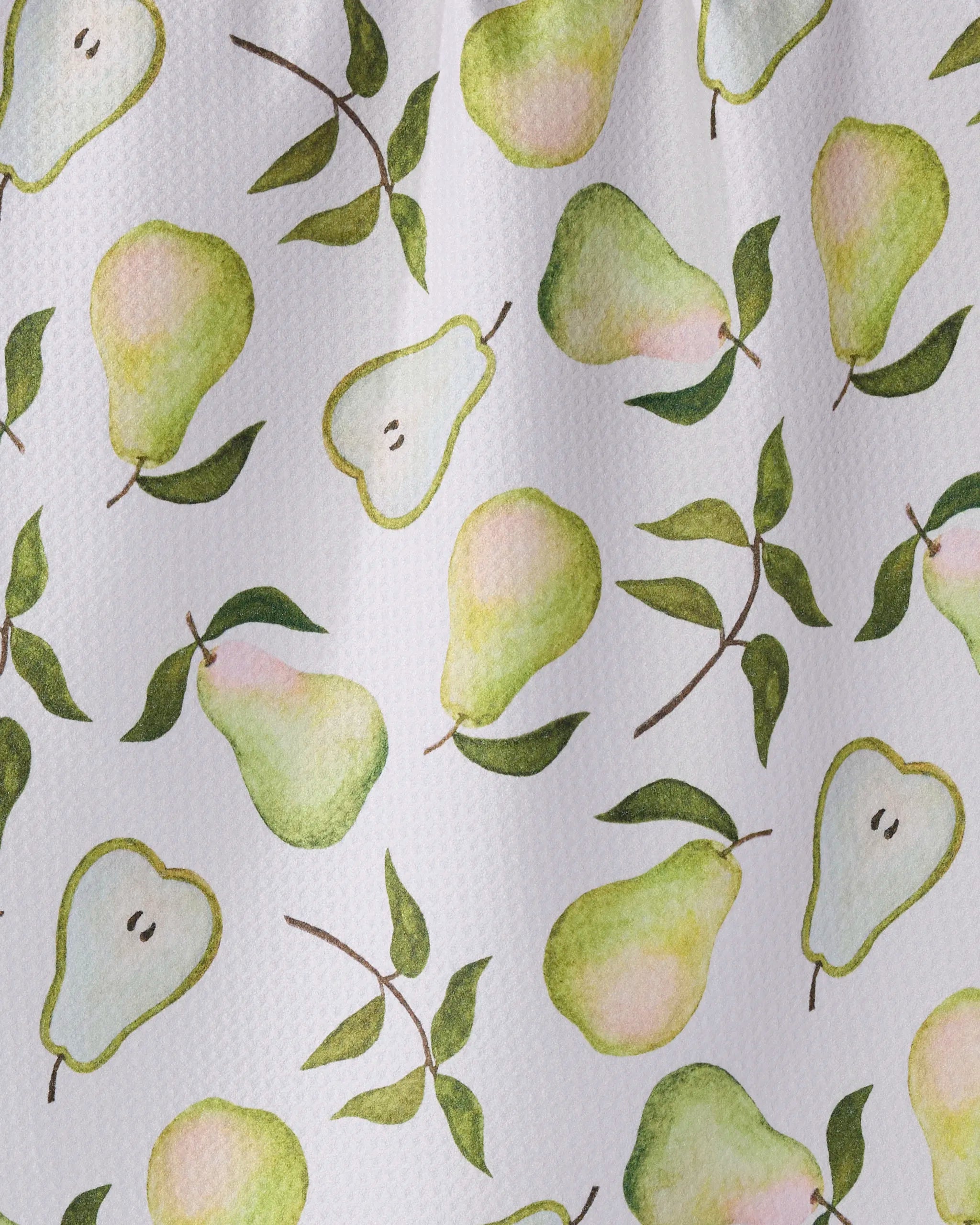 The Pearwood design by Geometry features watercolor-style green pears—both whole and halved—with leafy accents on a white textured backdrop, making it an eco-friendly pattern ideal for your kitchen tea towel.