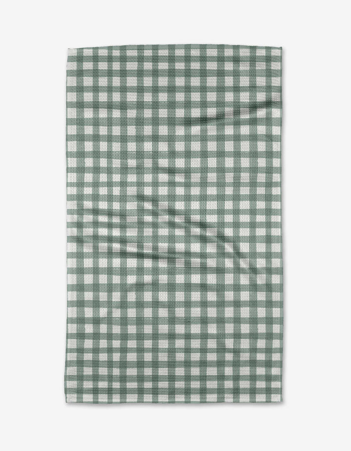 The Picnic Gingham tea towel by Hufton Studio, made from Geoweave™ fabric, features a green and white checkered pattern and is shown flat on a white surface with slight creases.