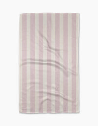 The Teri the Butter Pink Chevron Stripe tea towel features alternating vertical pink and white stripes, a slightly wrinkled texture, and neatly finished edges, displayed against a white background.