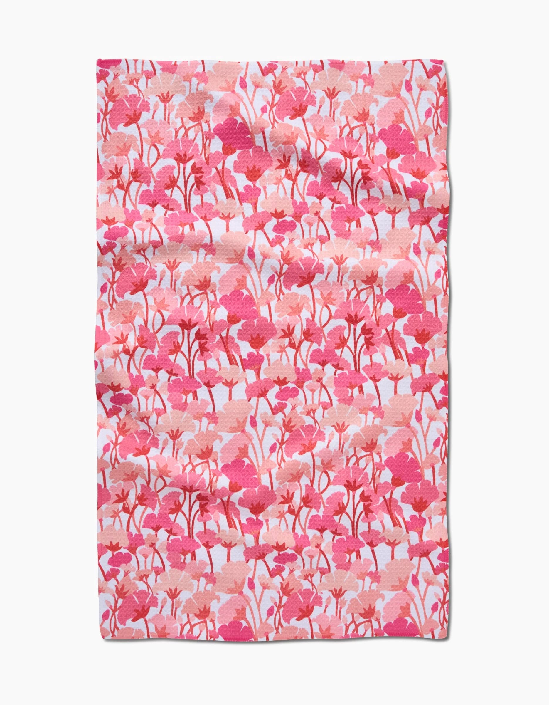 The Pink Florals Tea Towel by Katie OShea features a vibrant pink floral pattern on white, crafted from durable Geoweave fabric for excellent absorbency and texture.