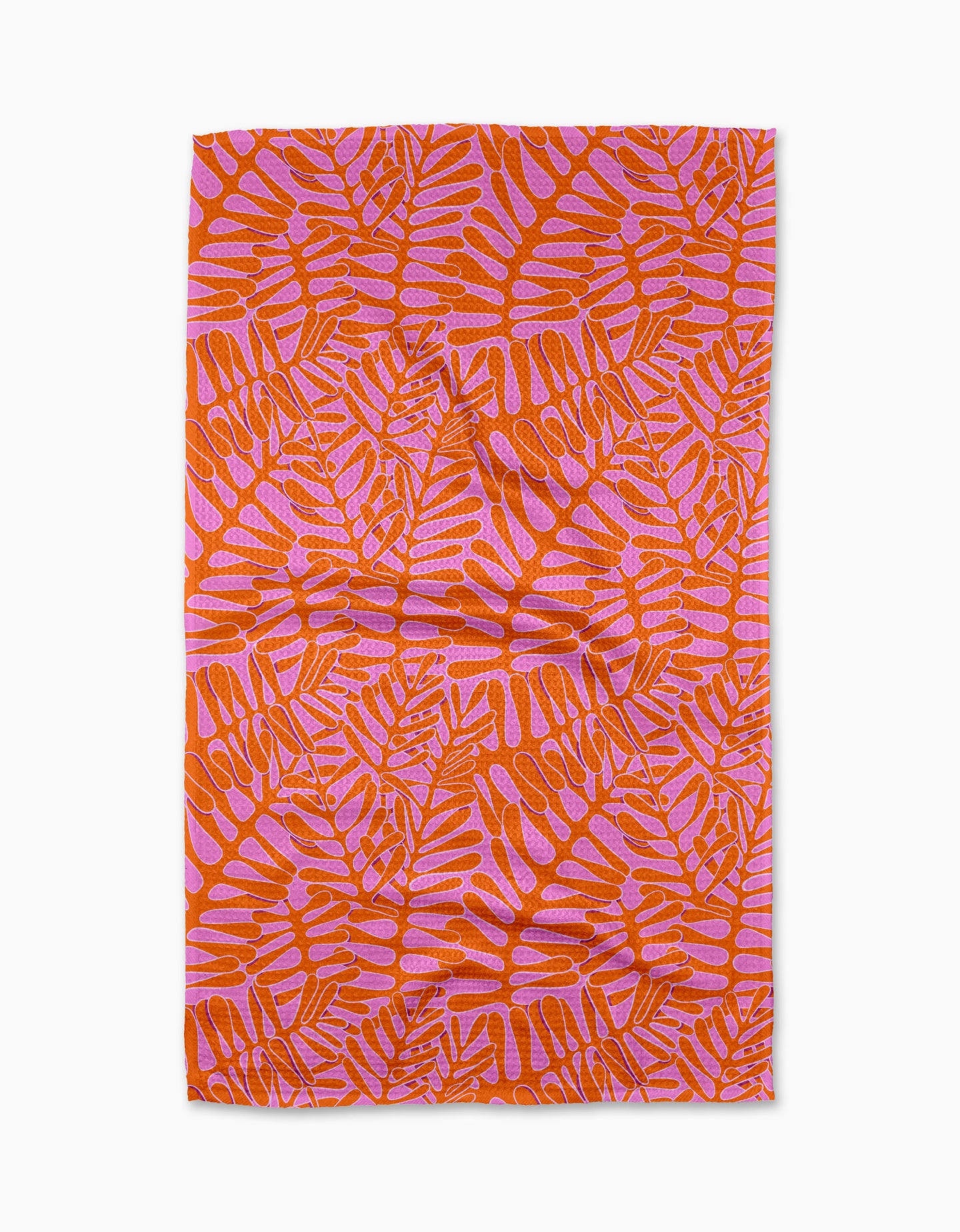 The Pink Modern Palm tea towel by Katie OShea features an orange and pink tropical palm design on white, made from recycled materials—an eco-friendly, stylish kitchen upgrade.