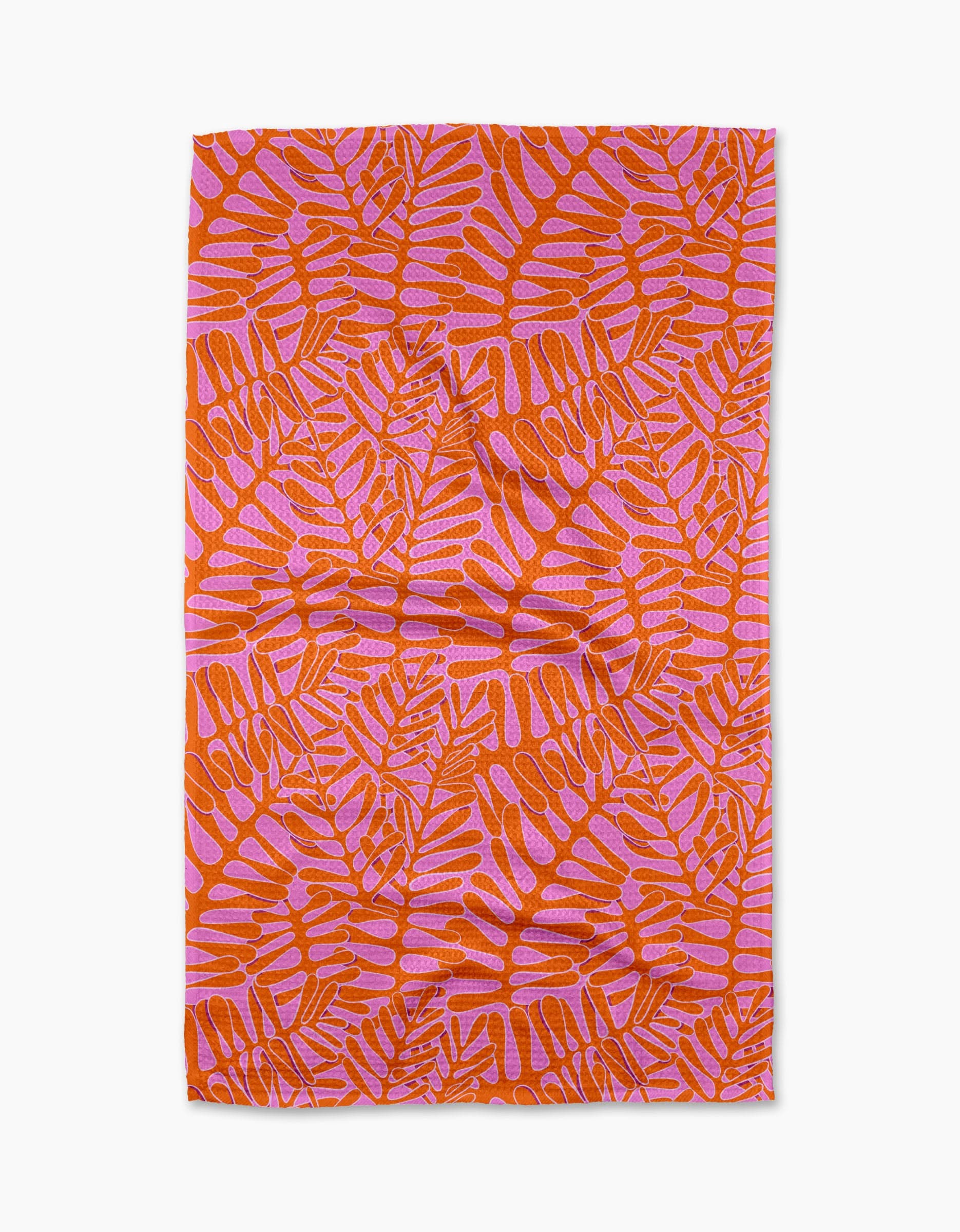 The Pink Modern Palm tea towel by Katie OShea features an orange and pink tropical palm design on white, made from recycled materials—an eco-friendly, stylish kitchen upgrade.