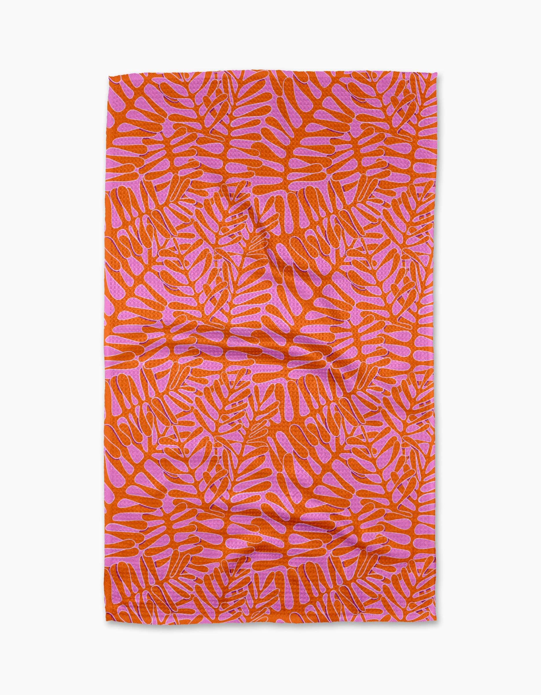 The Pink Modern Palm tea towel by Katie OShea features an orange and pink tropical palm design on white, made from recycled materials—an eco-friendly, stylish kitchen upgrade.