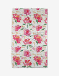 The Pink Peony Tea Towel by Elena Fay features a full-surface pattern of pink and red watercolor flowers, green leaves, and gold branches on white Geoweave fabric for a bright, cheerful look.