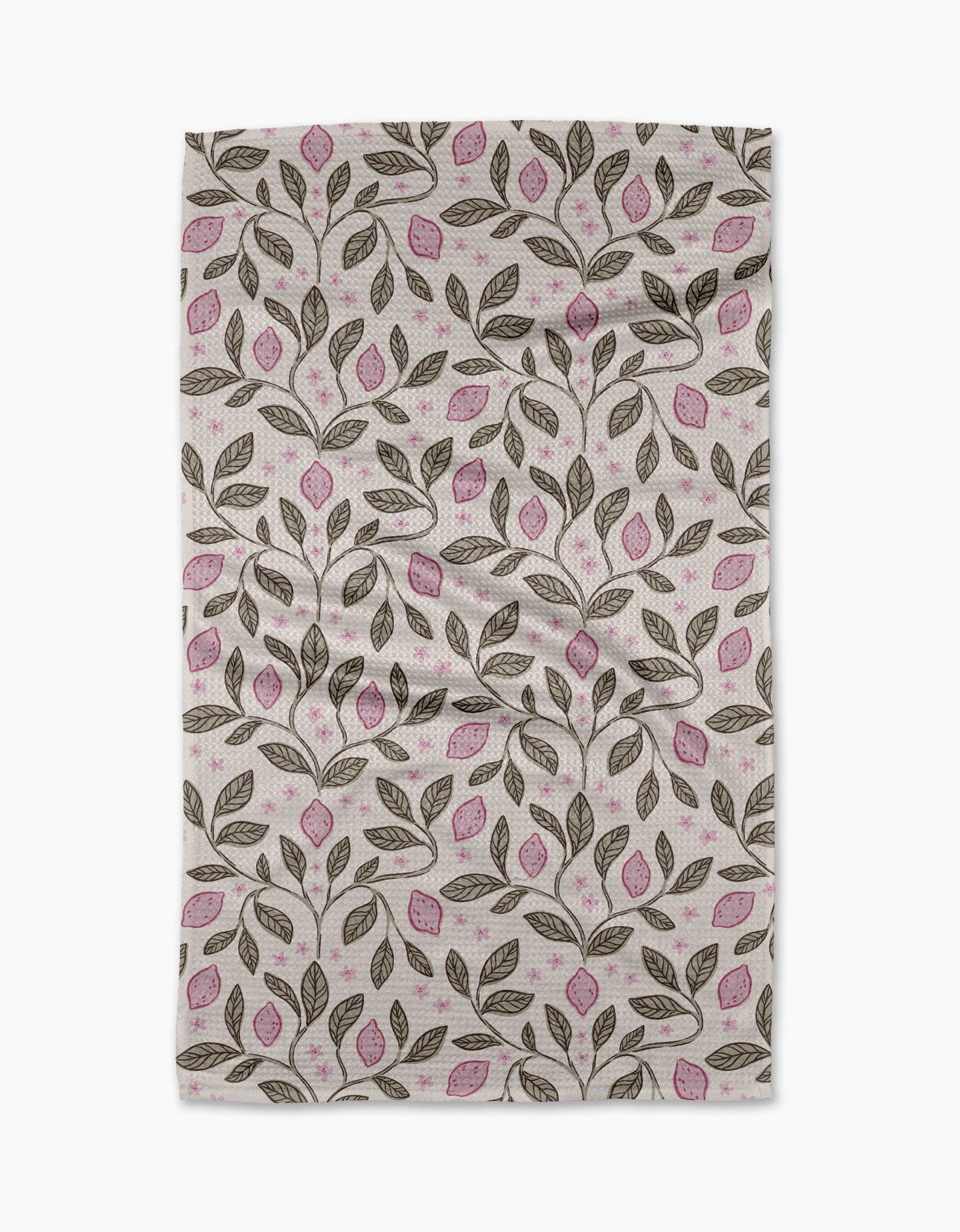 The Pink Summer Lemons tea towel by Teri the Butter features a repeating pattern of brown branches, pink-accented leaves, and a white background. Slightly wrinkled, it’s ultra-absorbent—ideal for everyday use.
