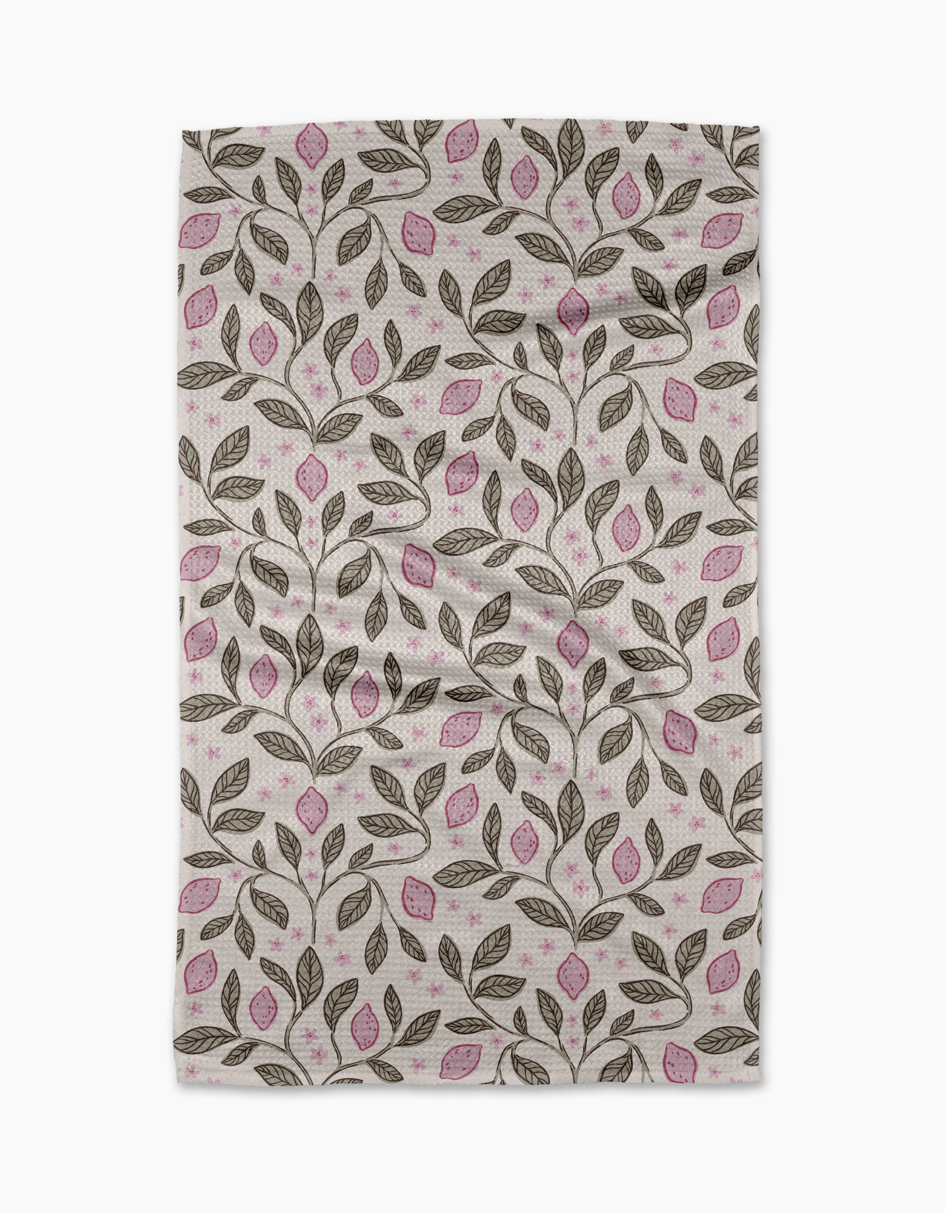 The Pink Summer Lemons tea towel by Teri the Butter features a repeating pattern of brown branches, pink-accented leaves, and a white background. Slightly wrinkled, it’s ultra-absorbent—ideal for everyday use.