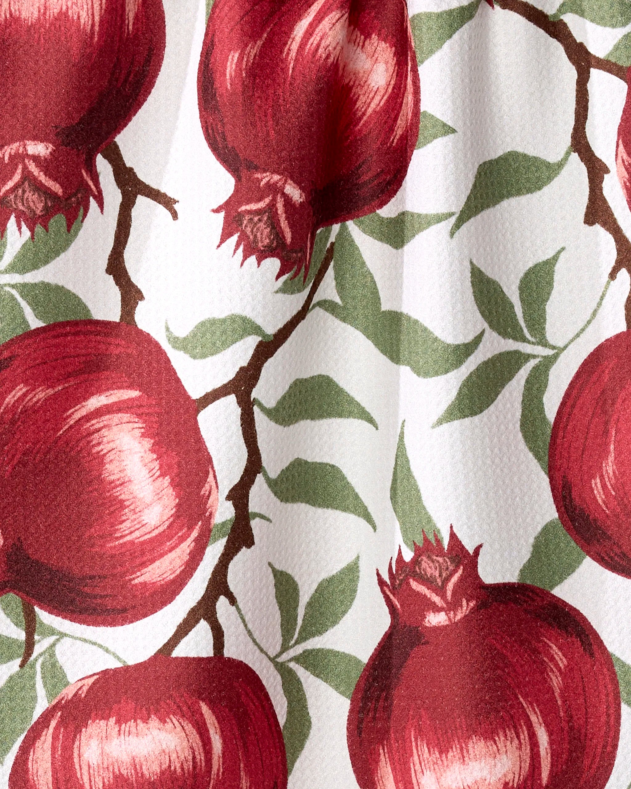 Ashley Reeves' "Pomegranate Party" tea towel features large red pomegranates and green leaves on light, textured, ultra-absorbent fabric for a fresh, vibrant look.