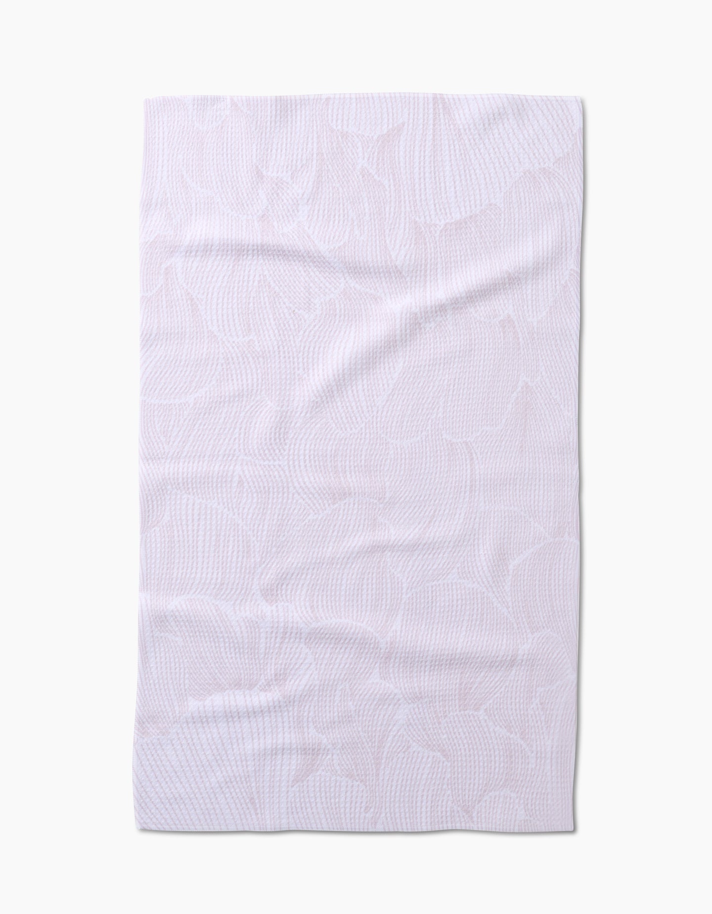 The Geometry Posh Petals Blushed Bergamot kitchen towel is shown flat on a white background, its subtle textured leaf-like pattern and slight wrinkles visible. Made from recycled materials for an eco-friendly touch.