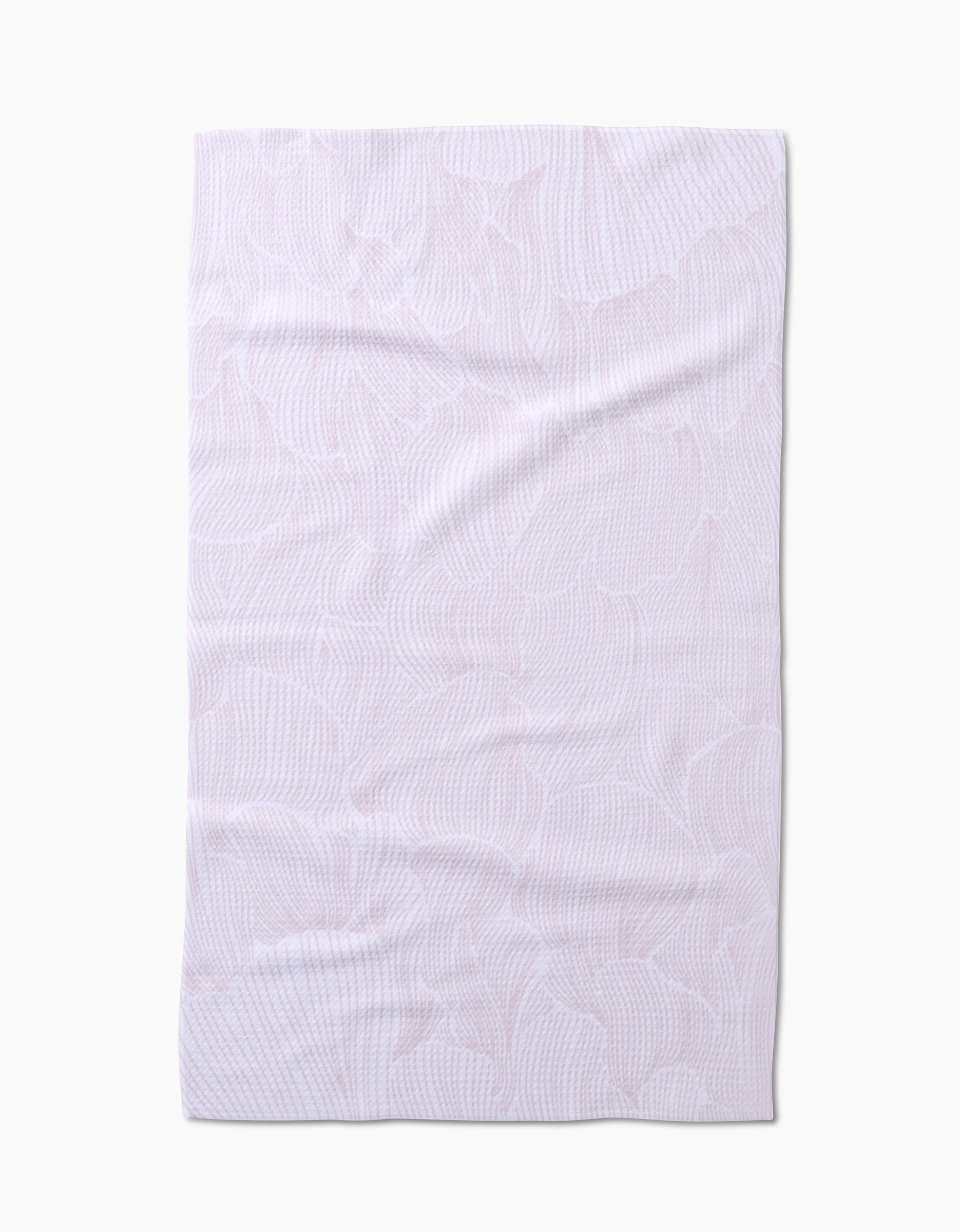 The Geometry Posh Petals Blushed Bergamot kitchen towel is shown flat on a white background, its subtle textured leaf-like pattern and slight wrinkles visible. Made from recycled materials for an eco-friendly touch.