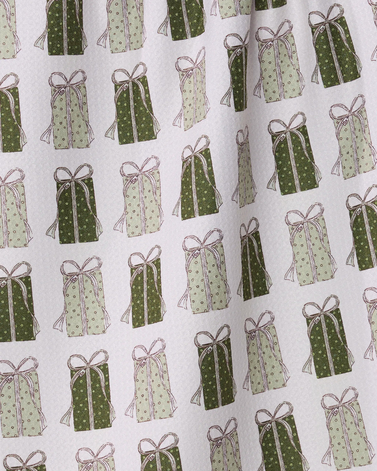 Present Parade by Geometry features a festive patterned fabric adorned with repeating illustrations of green and light green gift boxes with bows, each detailed with various dotted and lined designs and evenly spaced on a white background. This ultra-absorbent kitchen towel is crafted from recycled materials for a functional and eco-friendly touch.