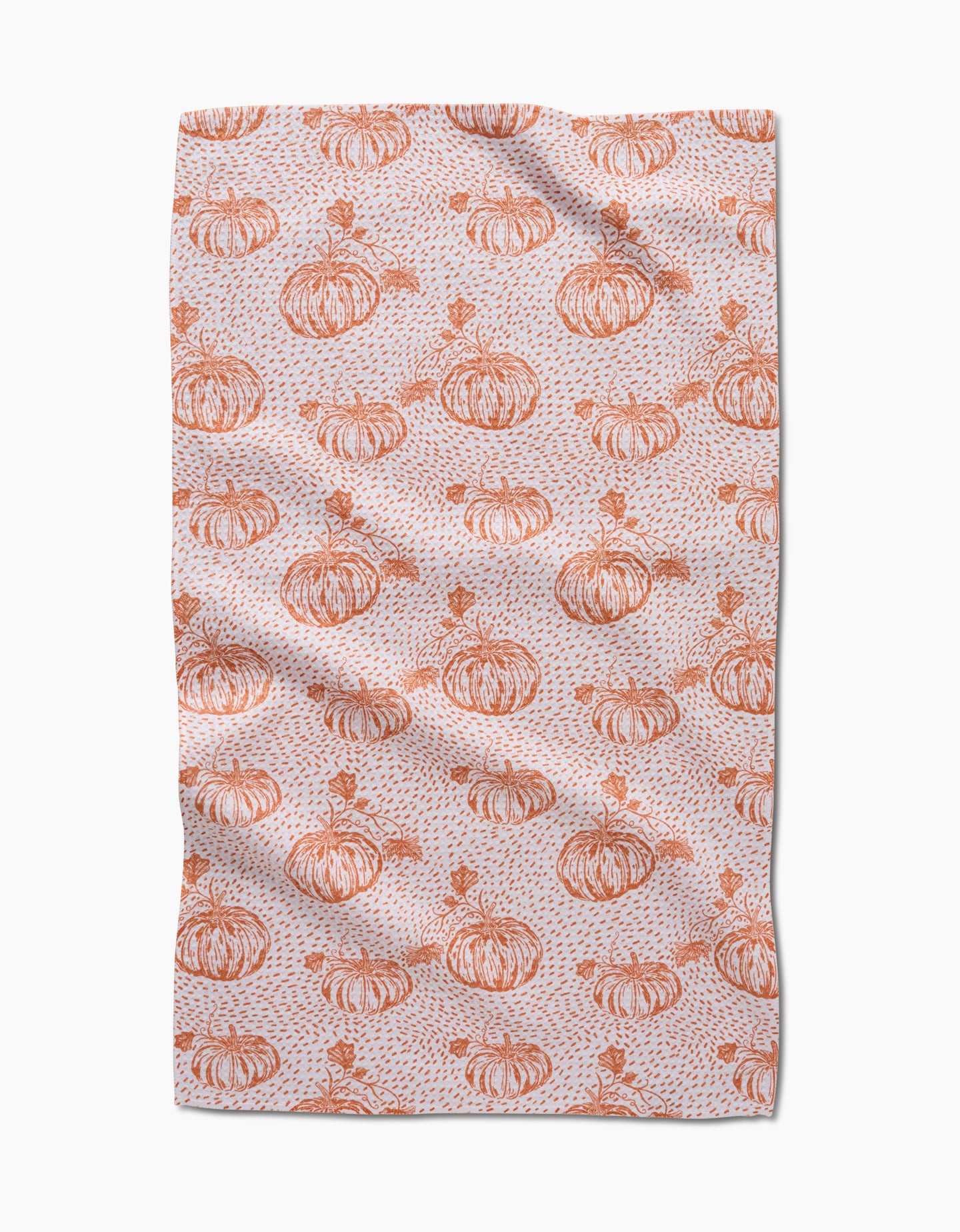 Pumpkin Field by Charlie Rowan Designs is a tea towel with hand-drawn orange pumpkins, leaves, and abstract speckles on a light background—perfect for adding charm to your kitchen.