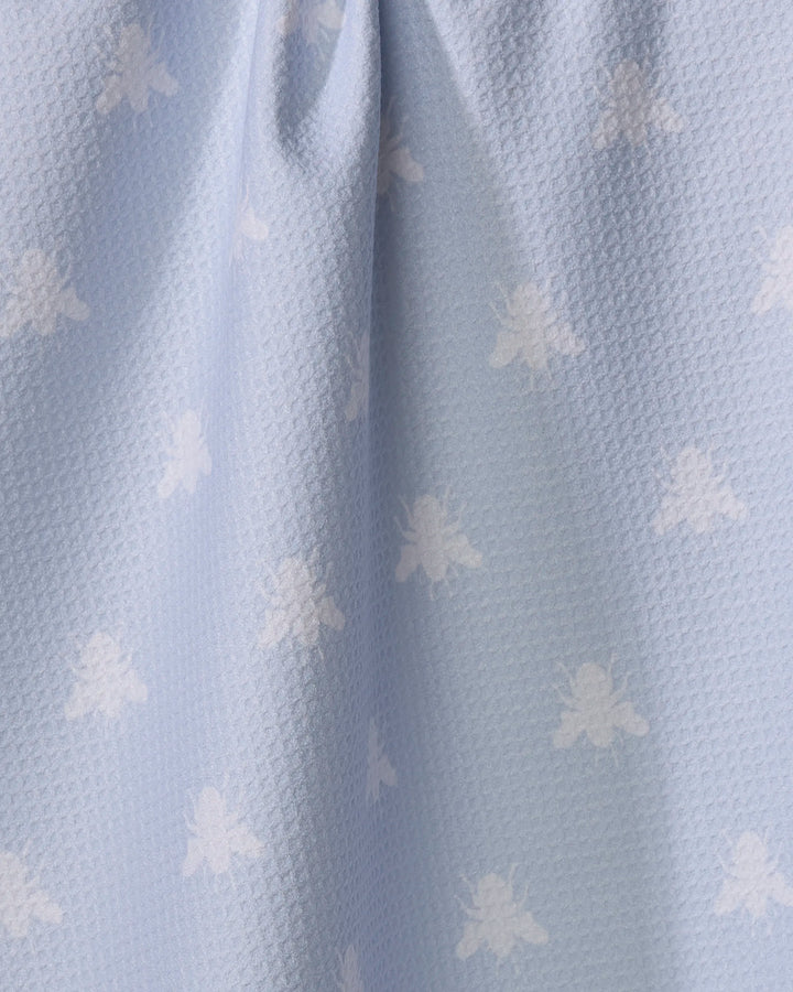 The Buy Guide’s Queen Bee - Light Blue features recycled, light blue textured fabric with a subtle white bee pattern. Gentle folds enhance its soft look, making it ideal for a kitchen tea towel.