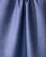 Close-up of Geometrys Rainfield, a blue absorbent kitchen towel crafted from recycled materials, with a subtle textured pattern and gathered seam near the top for soft folds and shadows.