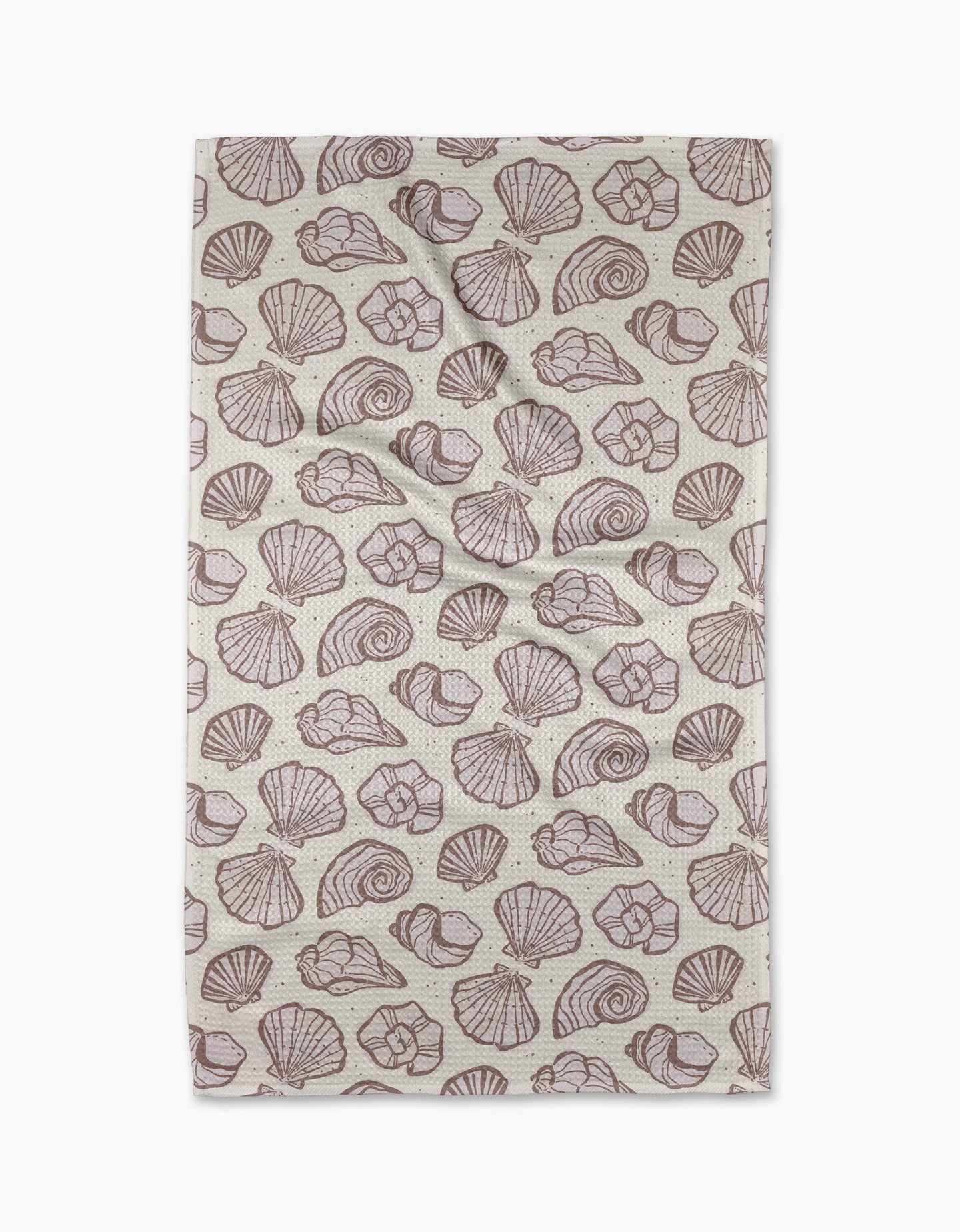 The Retro Coastal Seashells in Neutral tea towel by Teri the Butter features a repeating brown seashell pattern on beige, including scallops and spirals. Made from recycled materials, its shown flat with slight creases.