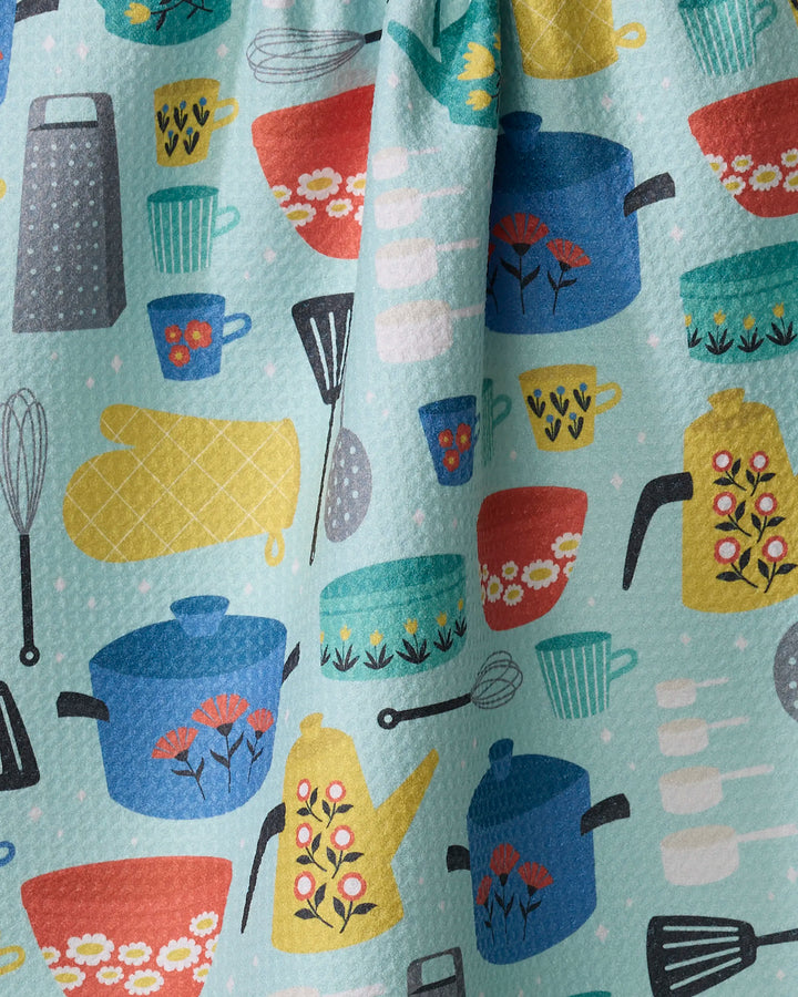 The Retro Kitchen tea towel by Megan Kampa features a lively kitchen-inspired pattern on Geoweave fabric, with pots, cups, and utensils on a light blue background with white dots—perfect for adding style to your kitchen.