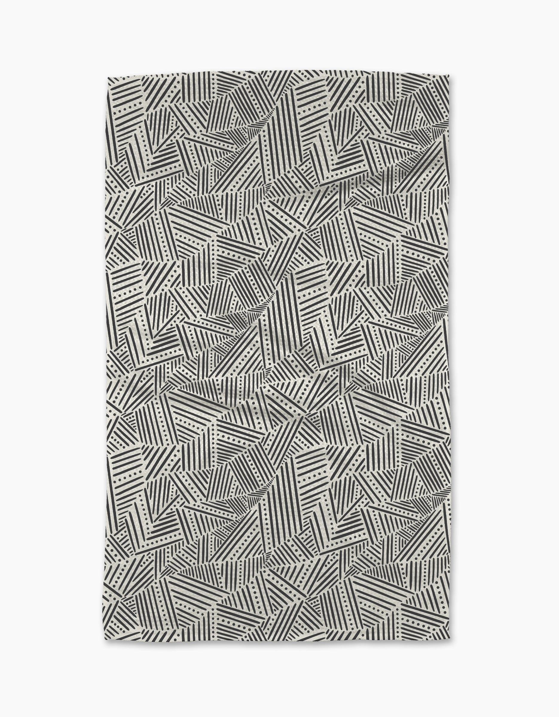 The Rhythm Current Stripes area rug by Sarah Daugherty features a black and white geometric pattern of overlapping lines, dots, and zigzags—an abstract, modern design perfect for enhancing your stylish kitchen space.