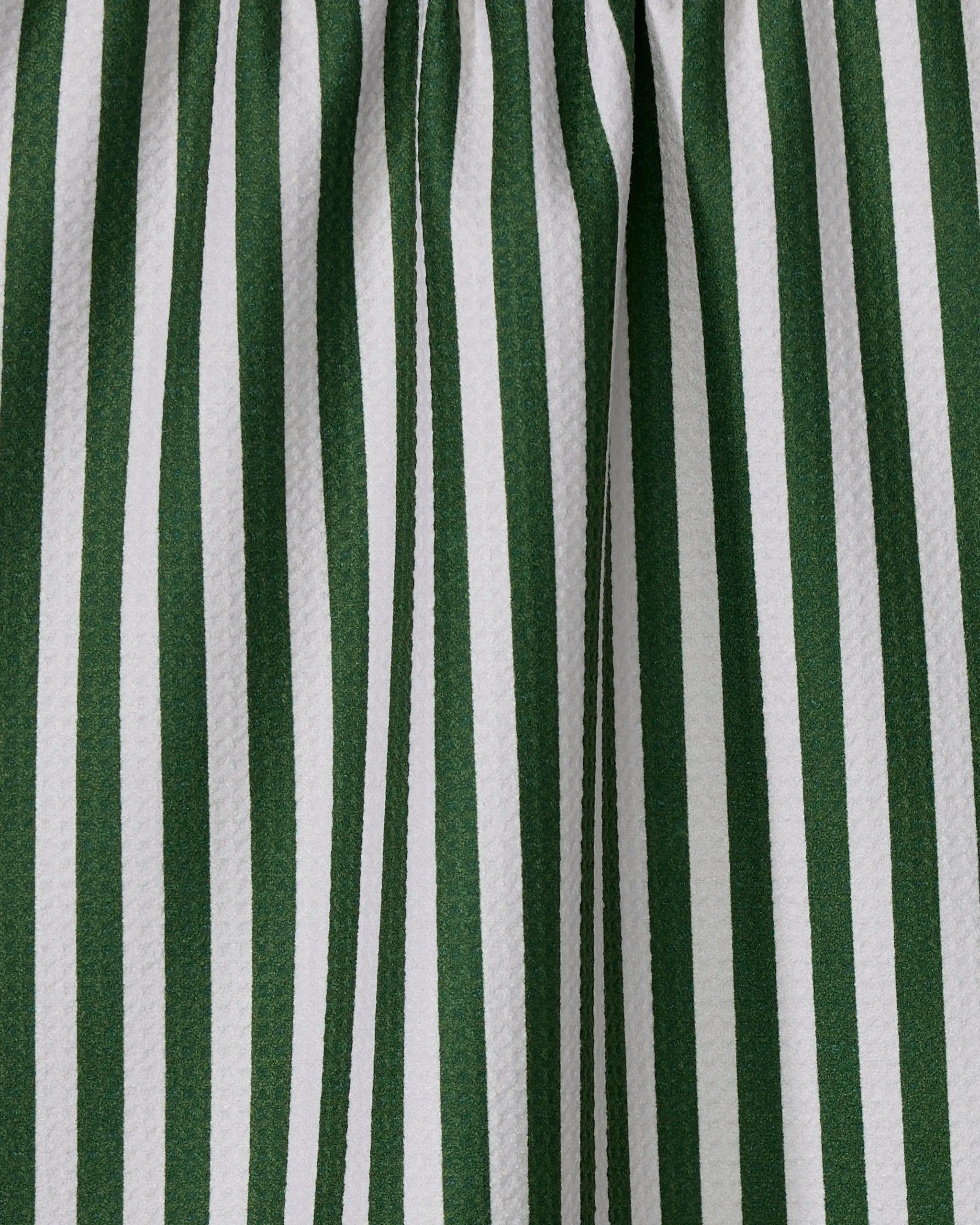 The Geometry Ribbon Green kitchen towel features absorbent, gathered fabric with green and white vertical stripes and textured folds, all made from recycled materials.