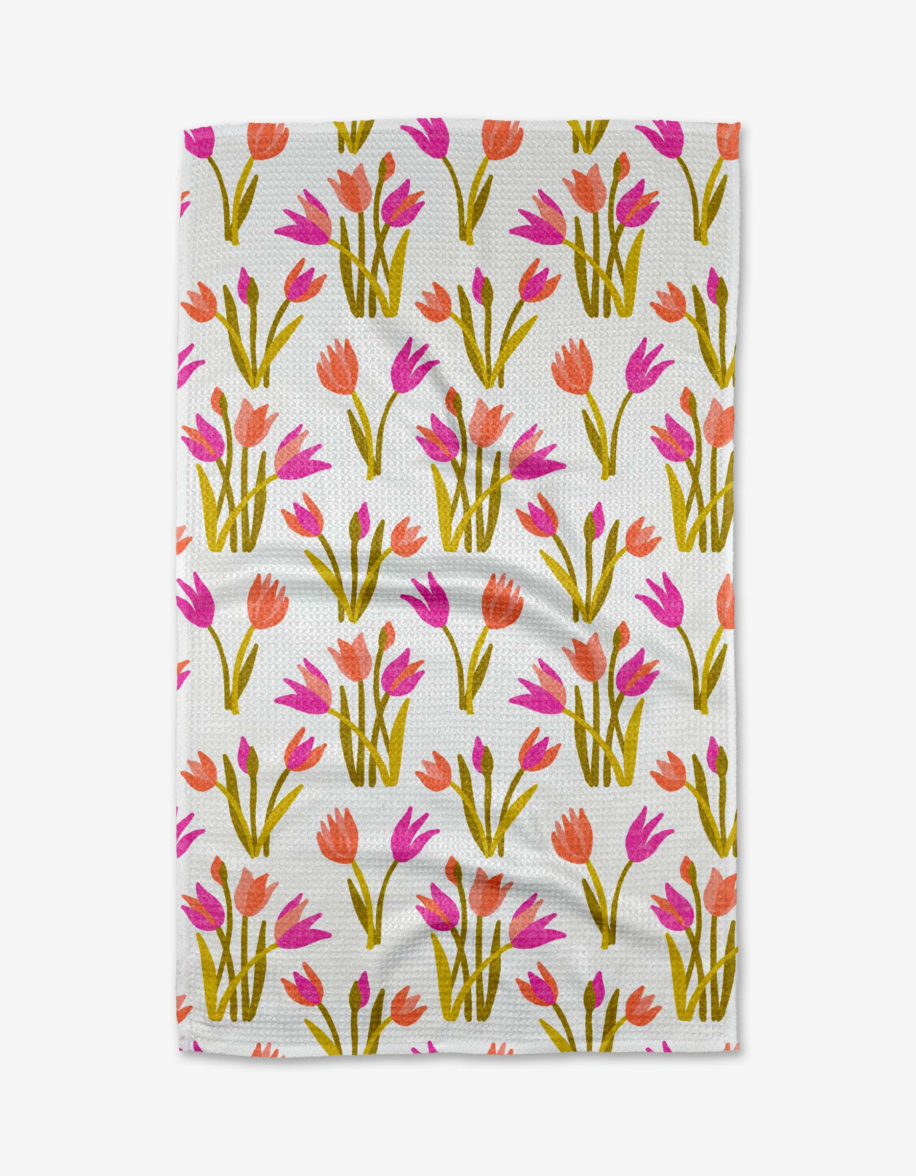 The Riley tea towel by Amy MacCready features a white textured surface with a repeating pink and orange tulip pattern, green stems and leaves, and is made from durable, absorbent Geoweave fabric.