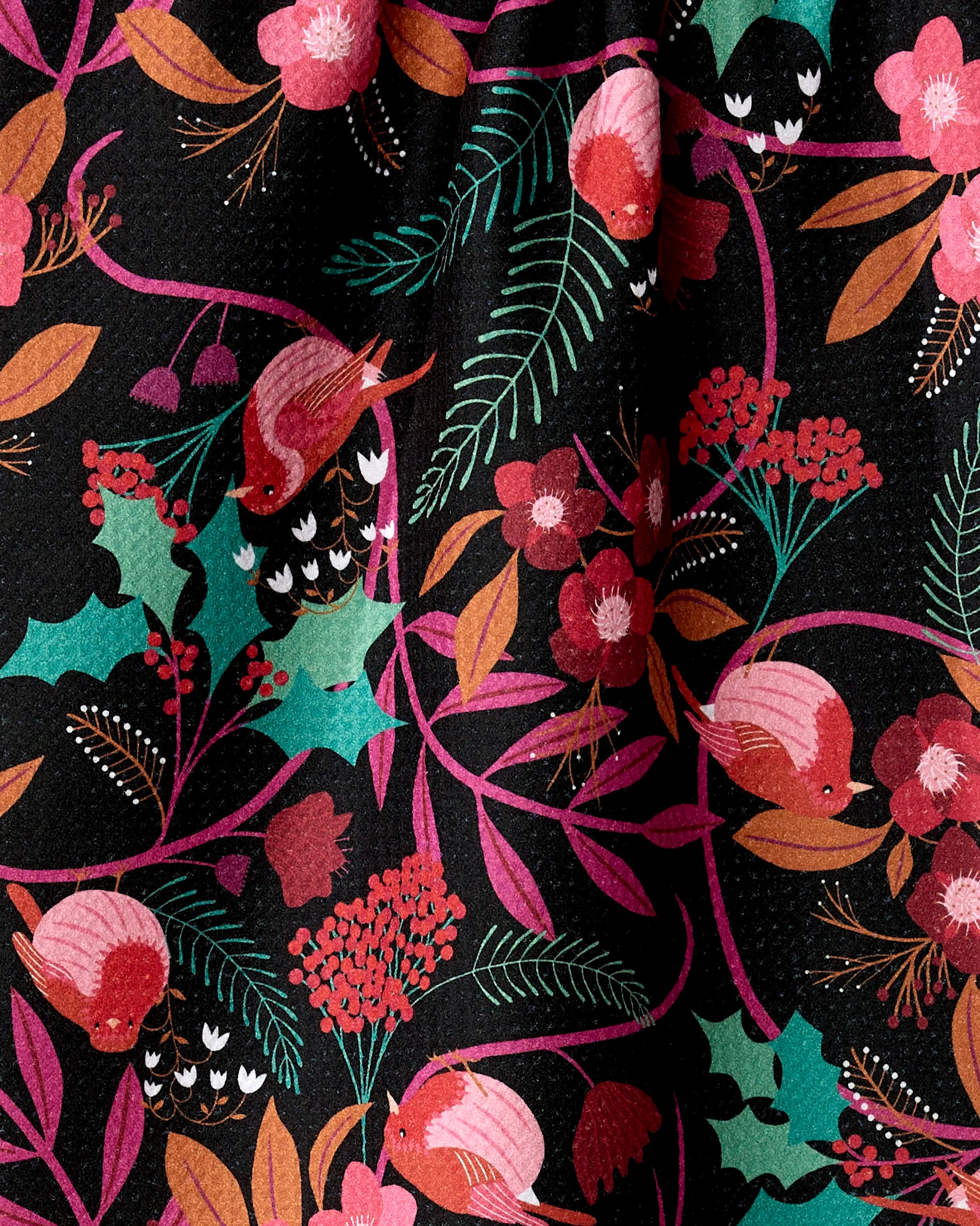 The "Robin Tree" tea towel by Rachel Parker showcases colorful robins, pink and red flowers, and green holly leaves on black textured fabric, all crafted from recycled materials for an eco-friendly touch.