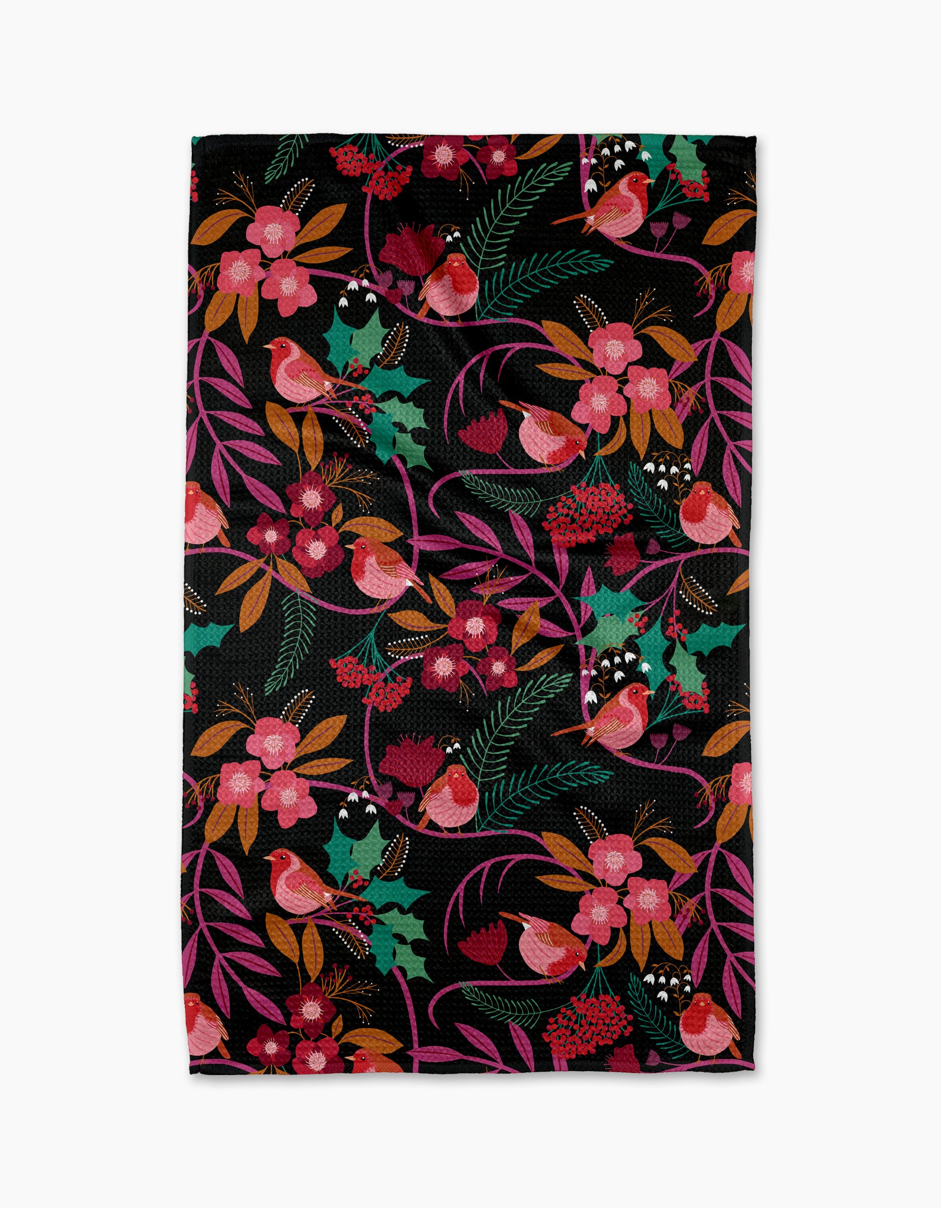 The Rachel Parker Robin Tree tea towel is quick-drying and showcases a colorful pattern of red cardinals, pink flowers, green holly leaves, and red berries on a black background.