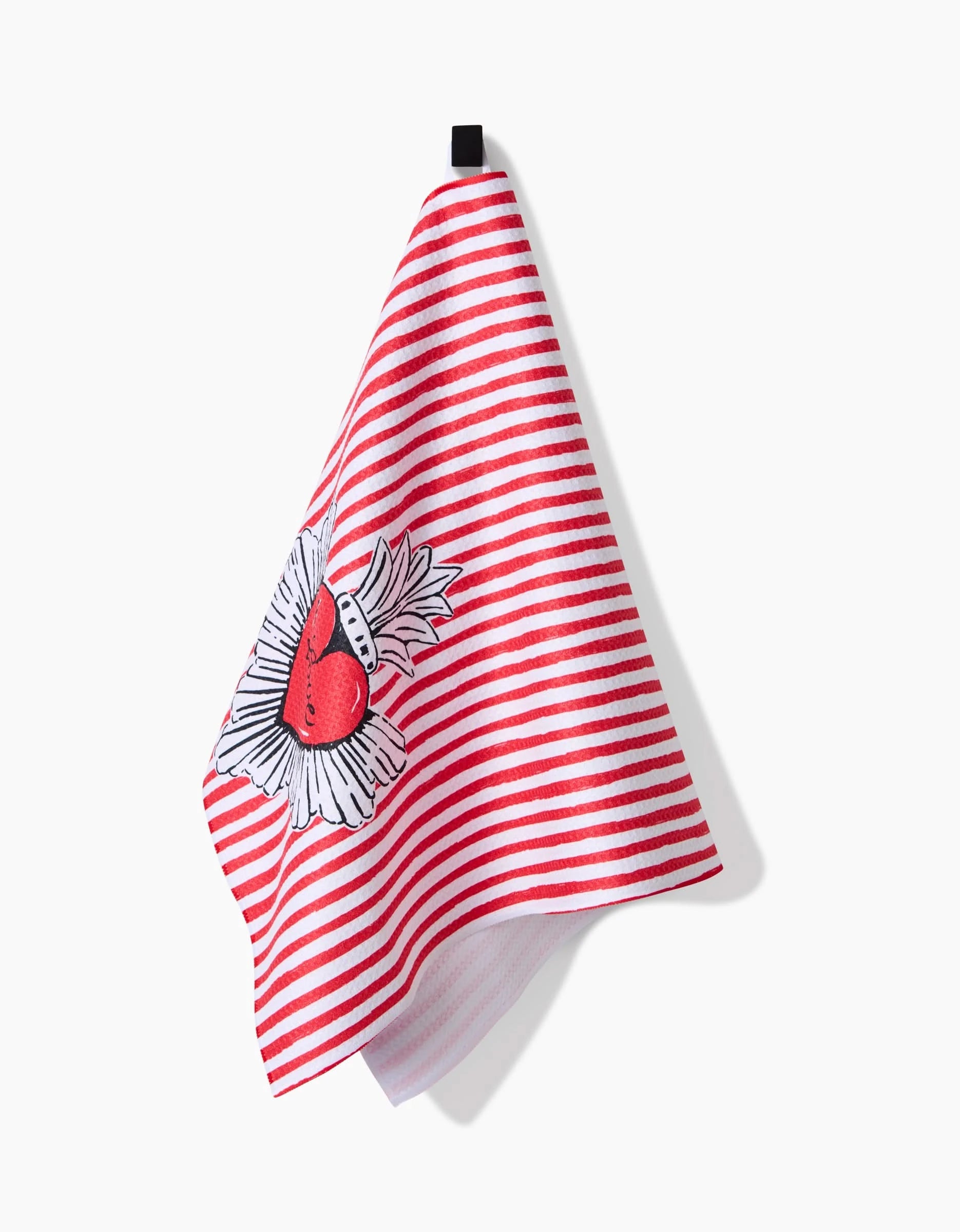 The Sacred Striped Love Hearts towel by Hufton Studio features red and white stripes, a bird and leaf motif, and hangs from a black loop against a white background.