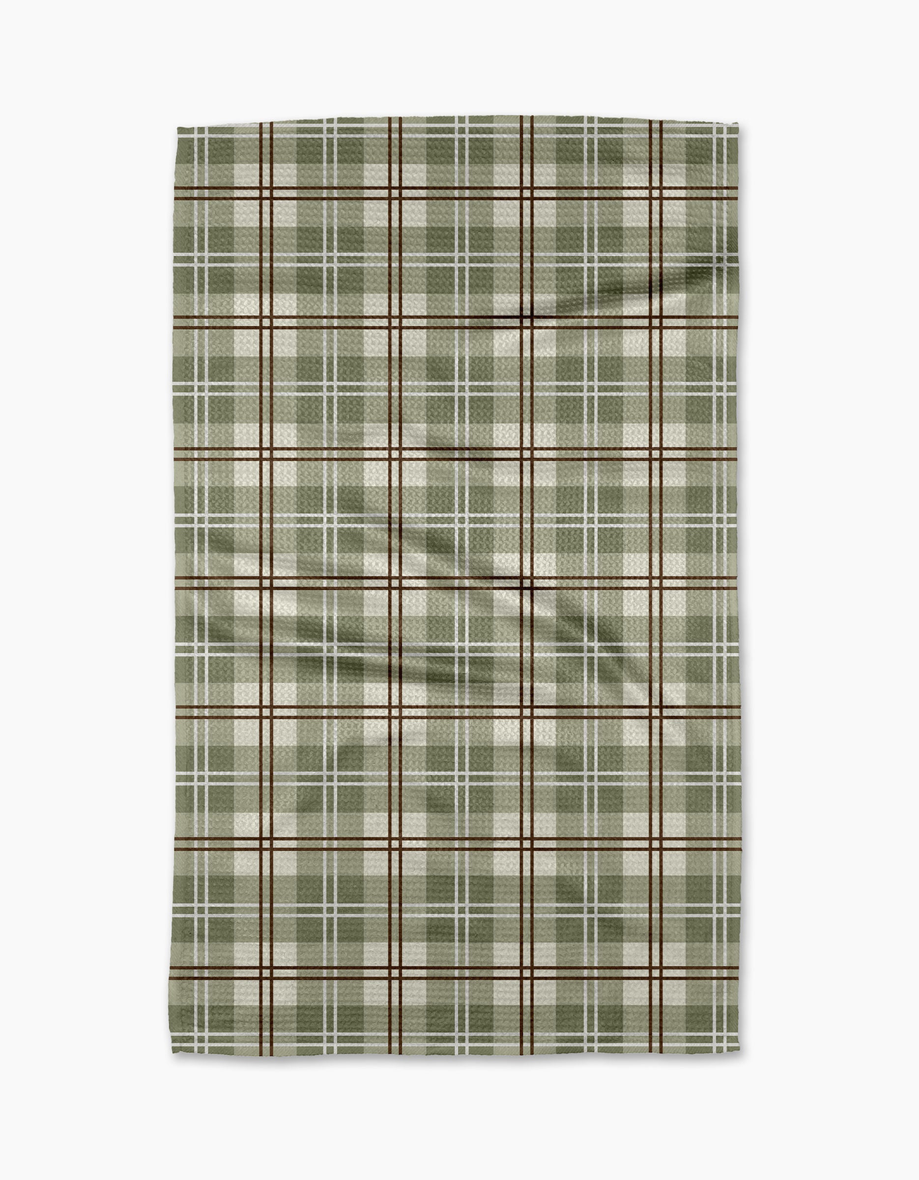 The Ashley Reeves "Sage Season" tea towel is a rectangular, recycled-material towel with a green, beige, and brown plaid pattern of intersecting lines and a slightly wrinkled texture, displayed on a white background.