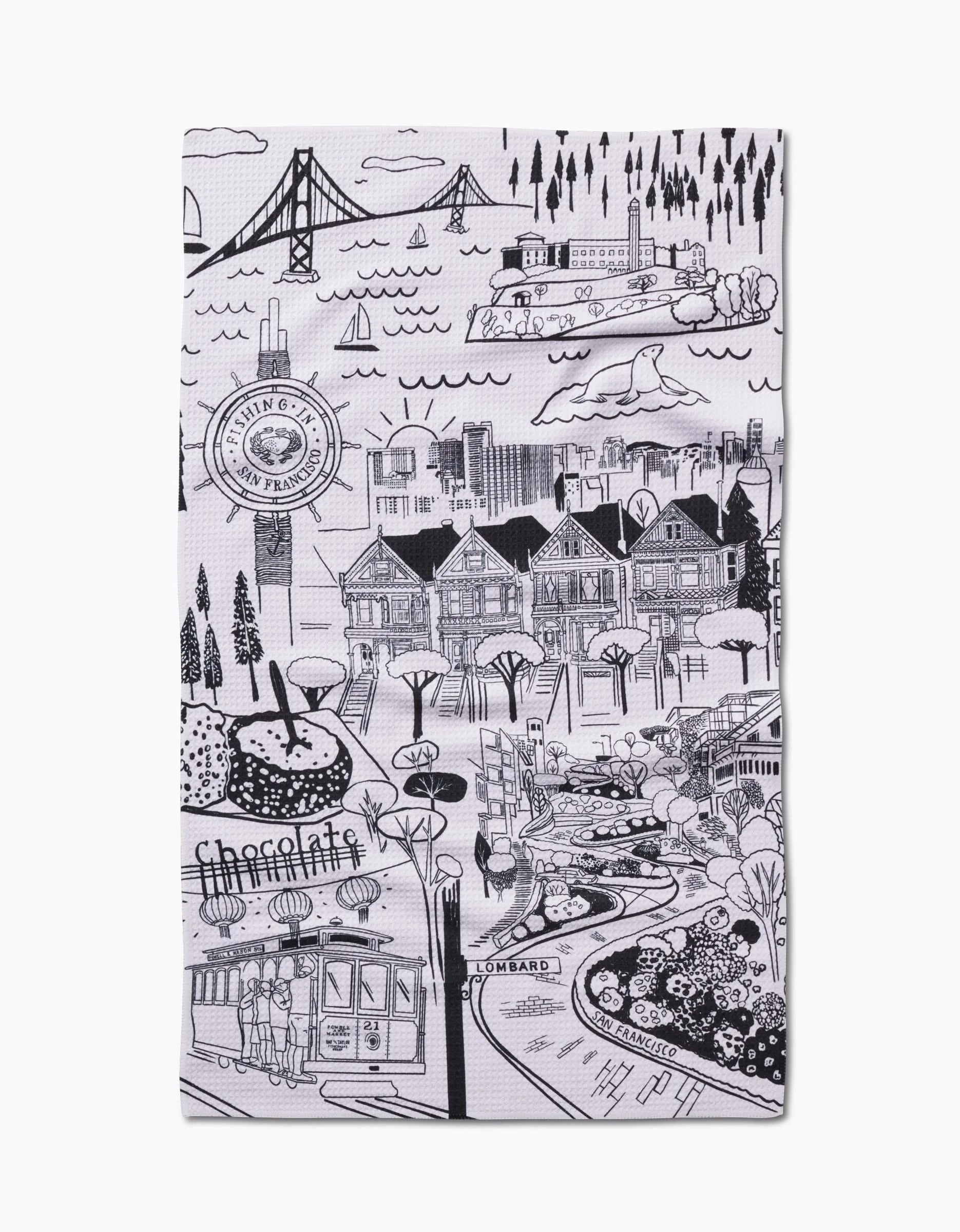 This black and white San Francisco tea towel by Elisabeth Wing shows landmarks like the Golden Gate Bridge, cable car, Painted Ladies, Lombard Street, and trees—printed on durable Geoweave fabric.